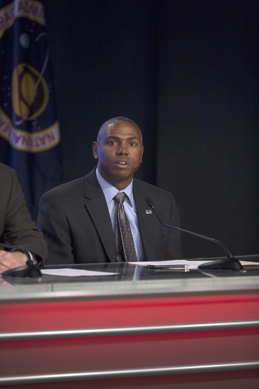 CAPE CANAVERAL, Fla. – In the Kennedy Space Center’s Press Site auditorium, members of the news media are briefed on the upcoming Orion flight test by Ron Fortson, United Launch Alliance director of Mission Management.      Orion is the exploration spacecraft designed to carry astronauts to destinations not yet explored by humans, including an asteroid and Mars. It will have emergency abort capability, sustain the crew during space travel and provide safe re-entry from deep space return velocities. The first unpiloted flight test of Orion is scheduled to launch Dec. 4, 2014 atop a United Launch Alliance Delta IV Heavy rocket, and in 2018 on NASA’s Space Launch System rocket. For more information, visit www.nasa.gov/orion Photo credit: NASA/Kim Shiflett