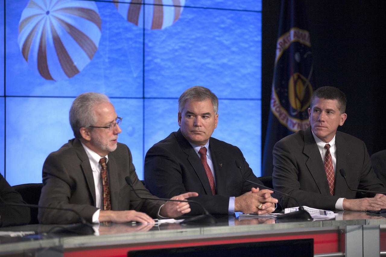CAPE CANAVERAL, Fla. – In the Kennedy Space Center’s Press Site auditorium, members of the news media are briefed on the upcoming Orion flight test by Mark Geyer, NASA Orion Program manager. Also participating in the news conference are Bryan Austin, Lockheed Martin mission manager, center, and Jeremy Graeber, Orion Recovery Director in Ground Systems Development and Operations at Kennedy.      Orion is the exploration spacecraft designed to carry astronauts to destinations not yet explored by humans, including an asteroid and Mars. It will have emergency abort capability, sustain the crew during space travel and provide safe re-entry from deep space return velocities. The first unpiloted flight test of Orion is scheduled to launch Dec. 4, 2014 atop a United Launch Alliance Delta IV Heavy rocket, and in 2018 on NASA’s Space Launch System rocket. For more information, visit www.nasa.gov/orion Photo credit: NASA/Kim Shiflett