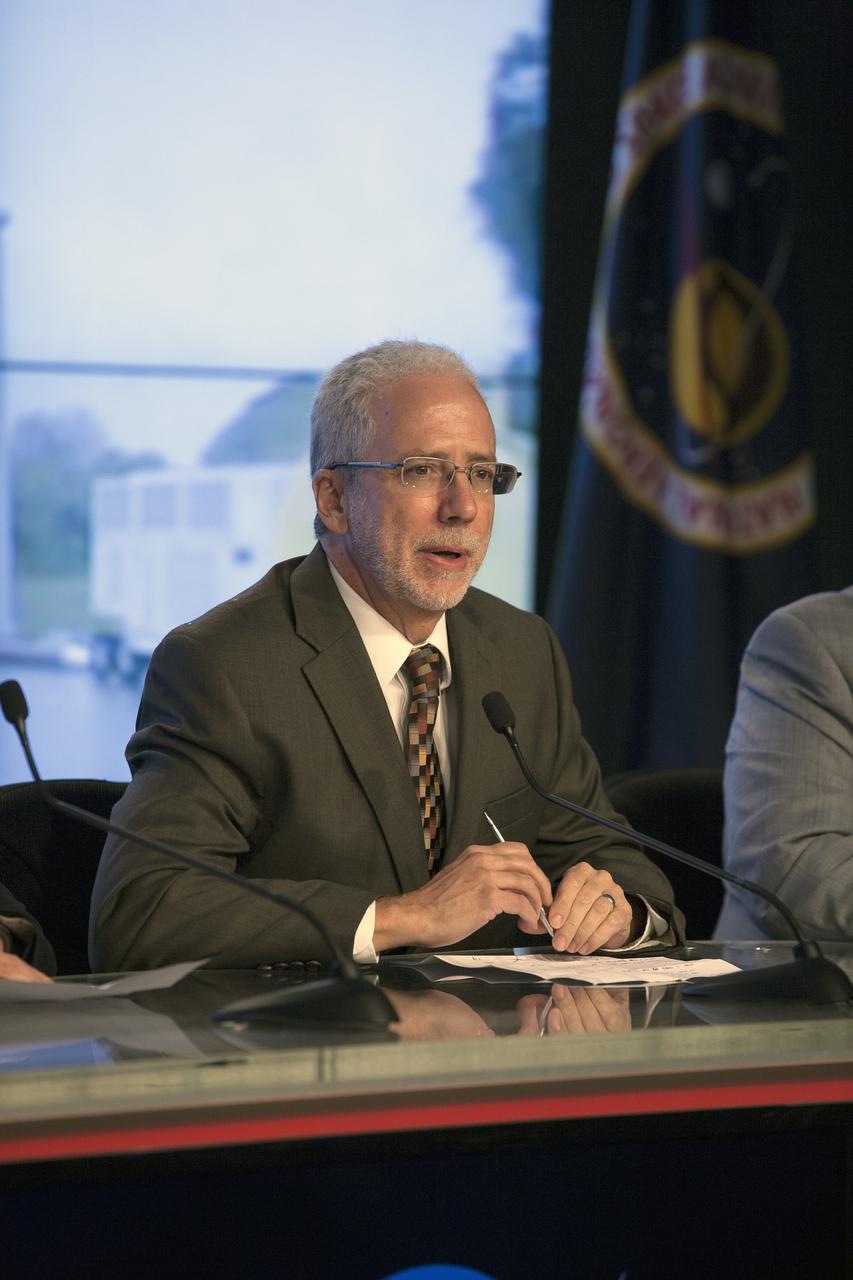 CAPE CANAVERAL, Fla. – In the Kennedy Space Center’s Press Site auditorium, NASA Orion Program manager Mark Geyer spoke to members of the news media as the completed Orion spacecraft was being prepared for its trip from the Launch Abort System Facility to Launch Complex 37 at Cape Canaveral Air Force Station.      Orion is the exploration spacecraft designed to carry astronauts to destinations not yet explored by humans, including an asteroid and Mars. It will have emergency abort capability, sustain the crew during space travel and provide safe re-entry from deep space return velocities. The first unpiloted flight test of Orion is scheduled to launch Dec. 4, 2014 atop a United Launch Alliance Delta IV Heavy rocket, and in 2018 on NASA’s Space Launch System rocket. For more information, visit www.nasa.gov/orion Photo credit: NASA/Kim Shiflett