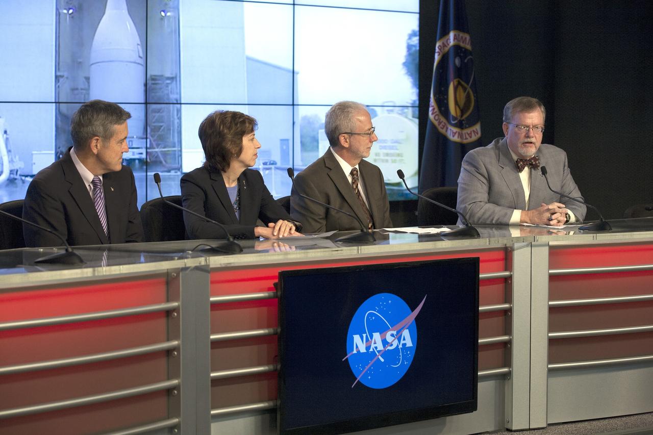 CAPE CANAVERAL, Fla. – In the Kennedy Space Center’s Press Site auditorium, agency leaders spoke to members of the news media as the completed Orion spacecraft was being prepared for its trip from the Launch Abort System Facility to Launch Complex 37 at Cape Canaveral Air Force Station. From left are: Kennedy Director Bob Cabana, Johnson Space Center Director Ellen Ochoa, NASA Orion Program manager Mark Geyer, and Lockheed Martin Orion Program manager Mike Hawes. Orion is the exploration spacecraft designed to carry astronauts to destinations not yet explored by humans, including an asteroid and Mars. It will have emergency abort capability, sustain the crew during space travel and provide safe re-entry from deep space return velocities. The first unpiloted flight test of Orion is scheduled to launch Dec. 4, 2014 atop a United Launch Alliance Delta IV Heavy rocket, and in 2018 on NASA’s Space Launch System rocket. For more information, visit www.nasa.gov/orion Photo credit: NASA/Kim Shiflett