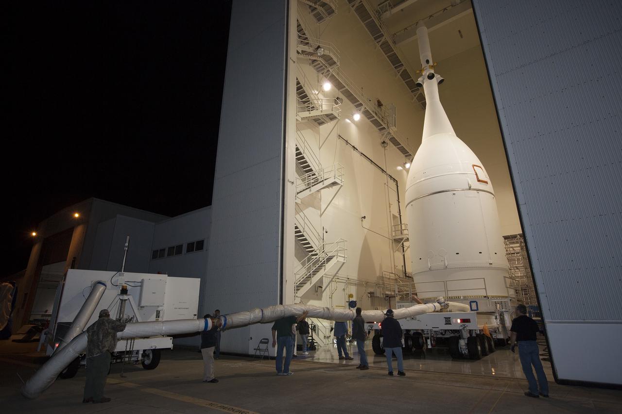CAPE CANAVERAL, Fla. – At NASA's Kennedy Space Center in Florida, the agency's completed Orion spacecraft begins its trip from the Launch Abort System Facility to Launch Complex 37 at Cape Canaveral Air Force Station. After arrival at the launch pad, United Launch Alliance engineers and technicians will lift Orion and mount it atop its Delta IV Heavy rocket.    Orion is the exploration spacecraft designed to carry astronauts to destinations not yet explored by humans, including an asteroid and Mars. It will have emergency abort capability, sustain the crew during space travel and provide safe re-entry from deep space return velocities. The first unpiloted flight test of Orion is scheduled to launch Dec. 4, 2014 atop a United Launch Alliance Delta IV Heavy rocket, and in 2018 on NASA’s Space Launch System rocket. For more information, visit www.nasa.gov/orion Photo credit: NASA/Kim Shiflett