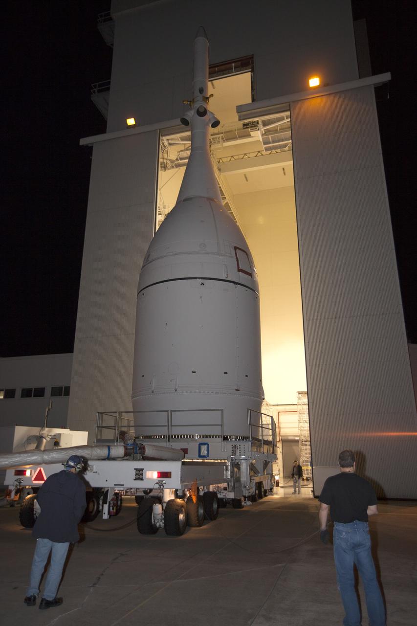CAPE CANAVERAL, Fla. – At NASA's Kennedy Space Center in Florida, the agency's completed Orion spacecraft begins its trip from the Launch Abort System Facility to Launch Complex 37 at Cape Canaveral Air Force Station. After arrival at the launch pad, United Launch Alliance engineers and technicians will lift Orion and mount it atop its Delta IV Heavy rocket.    Orion is the exploration spacecraft designed to carry astronauts to destinations not yet explored by humans, including an asteroid and Mars. It will have emergency abort capability, sustain the crew during space travel and provide safe re-entry from deep space return velocities. The first unpiloted flight test of Orion is scheduled to launch Dec. 4, 2014 atop a United Launch Alliance Delta IV Heavy rocket, and in 2018 on NASA’s Space Launch System rocket. For more information, visit www.nasa.gov/orion Photo credit: NASA/Kim Shiflett