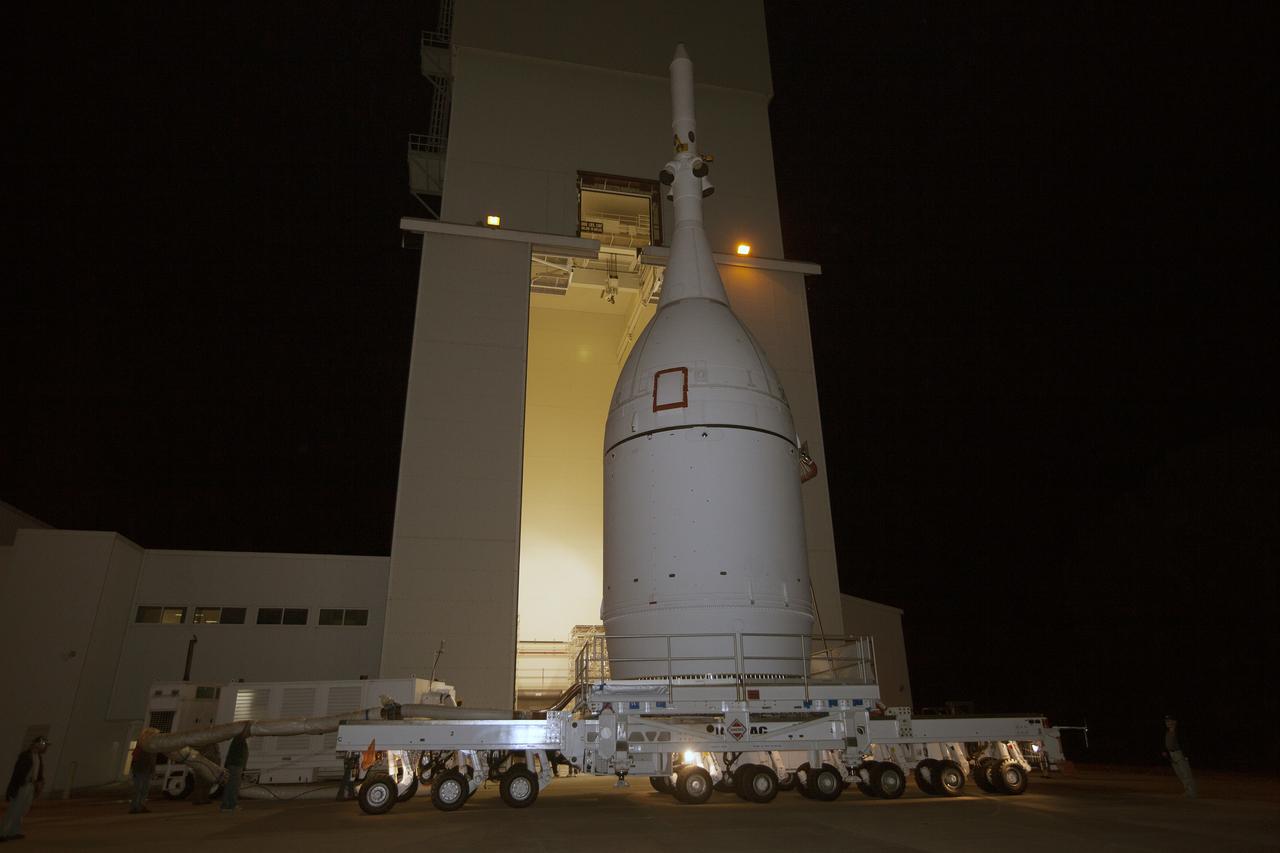 CAPE CANAVERAL, Fla. – At NASA's Kennedy Space Center in Florida, the agency's completed Orion spacecraft begins its trip from the Launch Abort System Facility to Launch Complex 37 at Cape Canaveral Air Force Station. After arrival at the launch pad, United Launch Alliance engineers and technicians will lift Orion and mount it atop its Delta IV Heavy rocket.    Orion is the exploration spacecraft designed to carry astronauts to destinations not yet explored by humans, including an asteroid and Mars. It will have emergency abort capability, sustain the crew during space travel and provide safe re-entry from deep space return velocities. The first unpiloted flight test of Orion is scheduled to launch Dec. 4, 2014 atop a United Launch Alliance Delta IV Heavy rocket, and in 2018 on NASA’s Space Launch System rocket. For more information, visit www.nasa.gov/orion Photo credit: NASA/Kim Shiflett