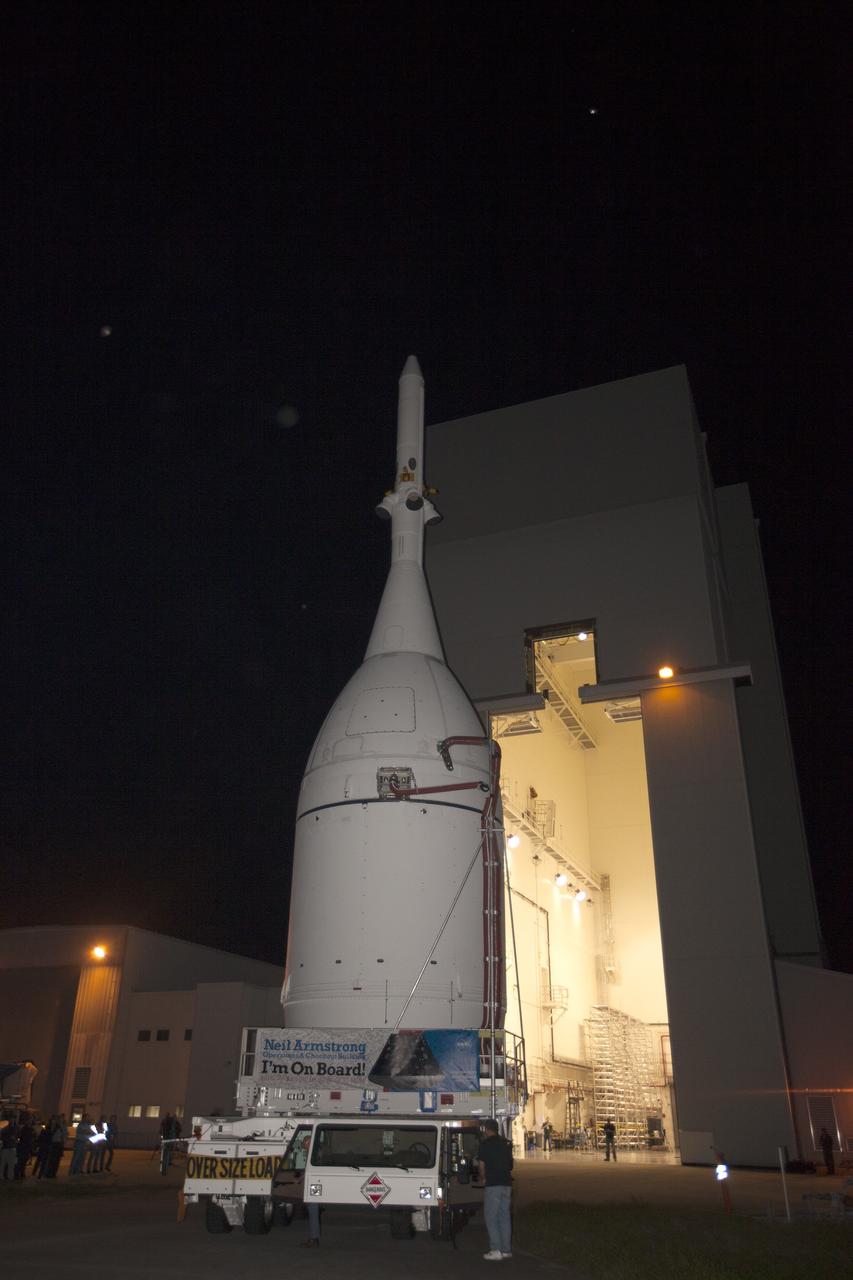 CAPE CANAVERAL, Fla. – At NASA's Kennedy Space Center in Florida, the agency's completed Orion spacecraft begins its trip from the Launch Abort System Facility to Launch Complex 37 at Cape Canaveral Air Force Station. Orion spent many months in Kennedy's Neil Armstrong Operations and Checkout Building undergoing final assembly. Hundreds of employees who work there signed the banner that states, "I'm On Board!" In doing so, their signature indicated they did their part to ensure mission success. After arrival at the launch pad, United Launch Alliance engineers and technicians will lift Orion and mount it atop its Delta IV Heavy rocket.      Orion is the exploration spacecraft designed to carry astronauts to destinations not yet explored by humans, including an asteroid and Mars. It will have emergency abort capability, sustain the crew during space travel and provide safe re-entry from deep space return velocities. The first unpiloted flight test of Orion is scheduled to launch Dec. 4, 2014 atop a United Launch Alliance Delta IV Heavy rocket, and in 2018 on NASA’s Space Launch System rocket. For more information, visit www.nasa.gov/orion Photo credit: NASA/Kim Shiflett