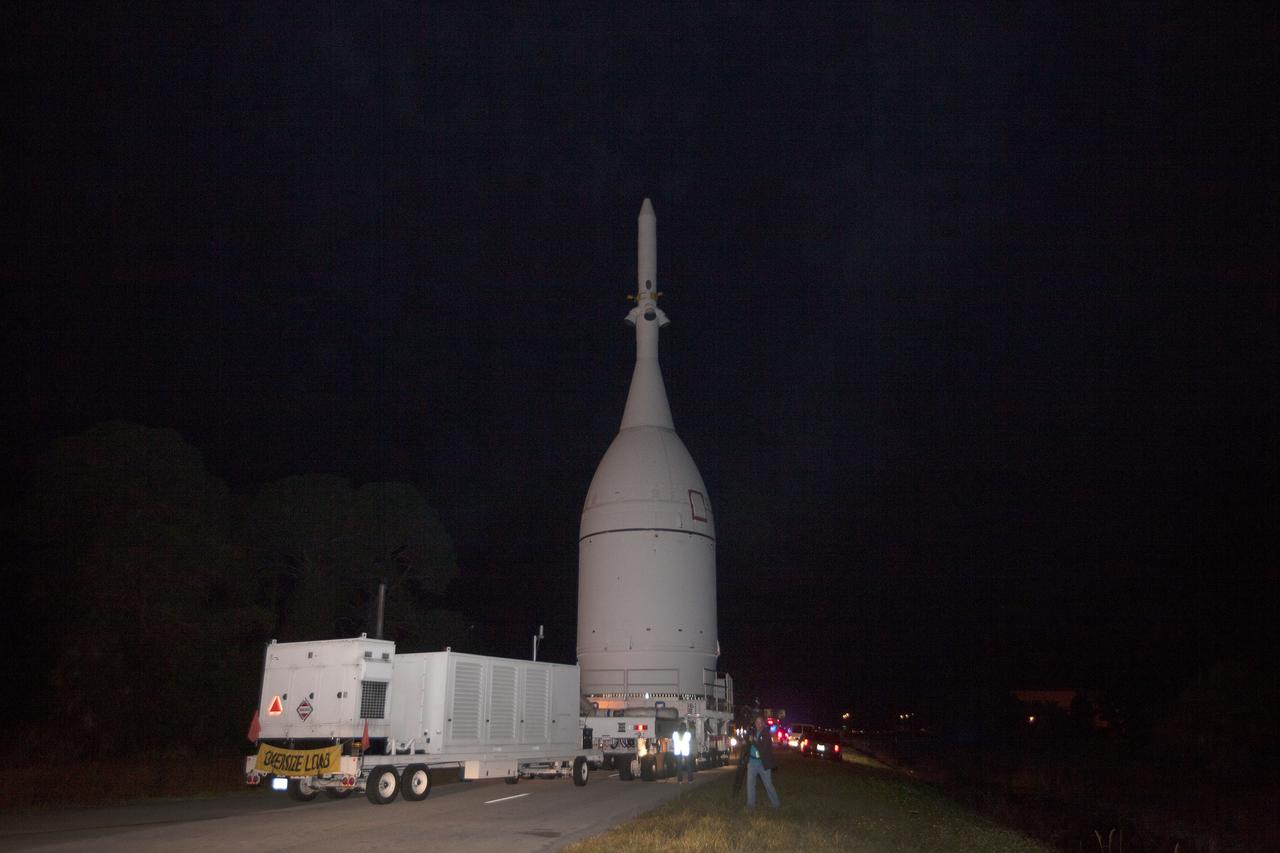 CAPE CANAVERAL, Fla. – At NASA's Kennedy Space Center in Florida, the agency's completed Orion spacecraft begins its trip from the Launch Abort System Facility to Launch Complex 37 at Cape Canaveral Air Force Station. After arrival at the launch pad, United Launch Alliance engineers and technicians will lift Orion and mount it atop its Delta IV Heavy rocket.      Orion is the exploration spacecraft designed to carry astronauts to destinations not yet explored by humans, including an asteroid and Mars. It will have emergency abort capability, sustain the crew during space travel and provide safe re-entry from deep space return velocities. The first unpiloted flight test of Orion is scheduled to launch Dec. 4, 2014 atop a United Launch Alliance Delta IV Heavy rocket, and in 2018 on NASA’s Space Launch System rocket. For more information, visit www.nasa.gov/orion Photo credit: NASA/Kim Shiflett