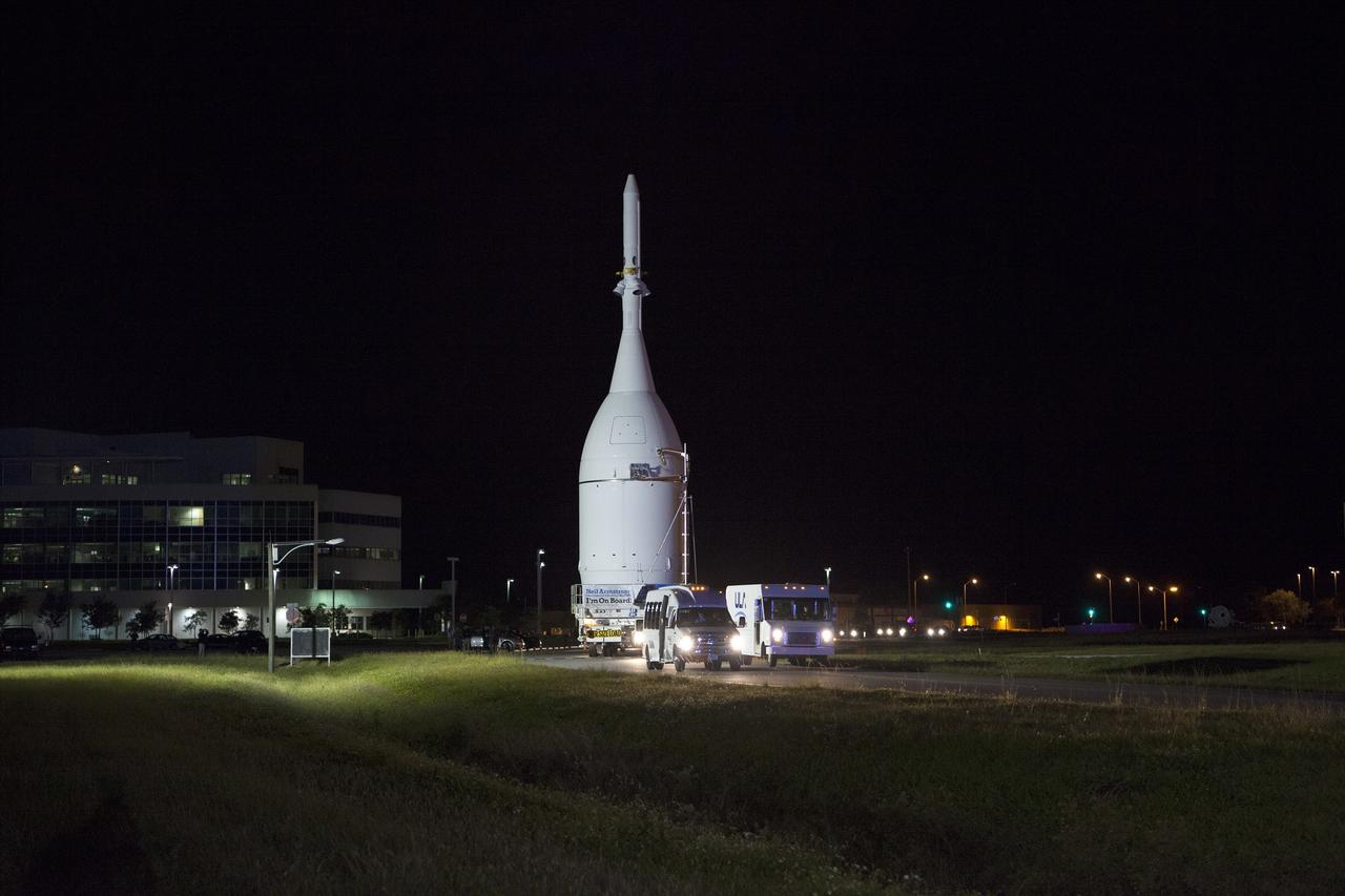 CAPE CANAVERAL, Fla. – At NASA's Kennedy Space Center in Florida, the agency's Orion is transported to Launch Complex 37 at Cape Canaveral Air Force Station. After arrival at the launch pad, United Launch Alliance engineers and technicians will lift Orion and mount it atop its Delta IV Heavy rocket.      Orion is the exploration spacecraft designed to carry astronauts to destinations not yet explored by humans, including an asteroid and Mars. It will have emergency abort capability, sustain the crew during space travel and provide safe re-entry from deep space return velocities. The first unpiloted flight test of Orion is scheduled to launch Dec. 4, 2014 atop a United Launch Alliance Delta IV Heavy rocket, and in 2018 on NASA’s Space Launch System rocket. For more information, visit www.nasa.gov/orion Photo credit: NASA/Frankie Martin