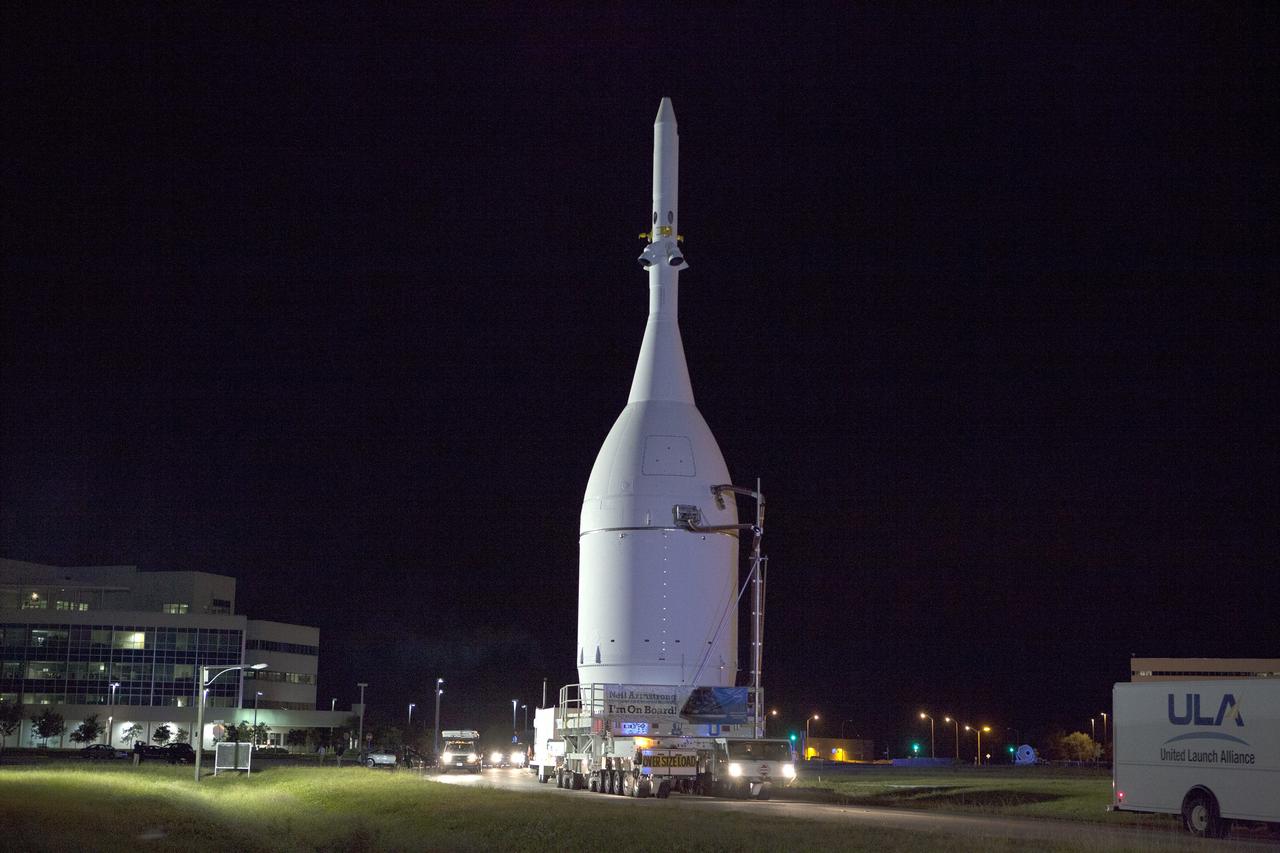 CAPE CANAVERAL, Fla. – At NASA's Kennedy Space Center in Florida, the agency's Orion is transported to Launch Complex 37 at Cape Canaveral Air Force Station. After arrival at the launch pad, United Launch Alliance engineers and technicians will lift Orion and mount it atop its Delta IV Heavy rocket.      Orion is the exploration spacecraft designed to carry astronauts to destinations not yet explored by humans, including an asteroid and Mars. It will have emergency abort capability, sustain the crew during space travel and provide safe re-entry from deep space return velocities. The first unpiloted flight test of Orion is scheduled to launch Dec. 4, 2014 atop a United Launch Alliance Delta IV Heavy rocket, and in 2018 on NASA’s Space Launch System rocket. For more information, visit www.nasa.gov/orion Photo credit: NASA/Frankie Martin