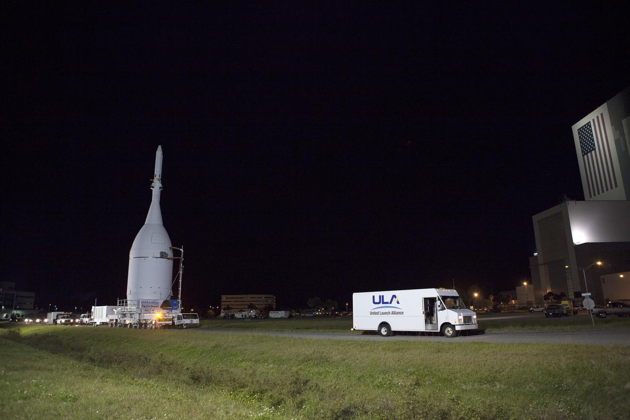 CAPE CANAVERAL, Fla. – At NASA's Kennedy Space Center in Florida, the agency's Orion is transported to Launch Complex 37 at Cape Canaveral Air Force Station. After arrival at the launch pad, United Launch Alliance engineers and technicians will lift Orion and mount it atop its Delta IV Heavy rocket.      Orion is the exploration spacecraft designed to carry astronauts to destinations not yet explored by humans, including an asteroid and Mars. It will have emergency abort capability, sustain the crew during space travel and provide safe re-entry from deep space return velocities. The first unpiloted flight test of Orion is scheduled to launch Dec. 4, 2014 atop a United Launch Alliance Delta IV Heavy rocket, and in 2018 on NASA’s Space Launch System rocket. For more information, visit www.nasa.gov/orion Photo credit: NASA/Frankie Martin