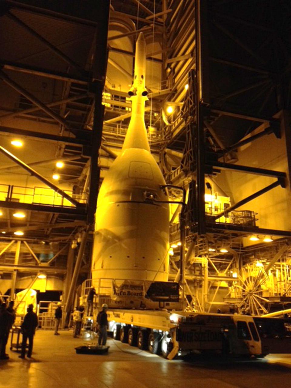 CAPE CANAVERAL, Fla. - Engineers and technicians at Space Launch Complex 37 move Orion into place in the service structure so the spacecraft can be lifted and joined to the top of the Delta IV Heavy rocket.  Orion is the exploration spacecraft designed to carry astronauts to destinations not yet explored by humans, including an asteroid and Mars. It will have emergency abort capability, sustain the crew during space travel and provide safe re-entry from deep space return velocities. The first unpiloted flight test of Orion is scheduled to launch Dec. 4, 2014, atop a United Launch Alliance Delta IV Heavy rocket, and in 2018 on NASA’s Space Launch System rocket. For more information, visit www.nasa.gov/orion   The Multimedia Gallery is undergoing transition to an alternate Web portal. Please go to http://www.flickr.com/NASAKennedy for the latest photos and imagery of activity at NASA's Kennedy Space Center in Florida. The Multimedia Gallery will remain an archive for previous photos and events at Kennedy.  Photo credit: Photo credit: NASA/Ben Smegelsky