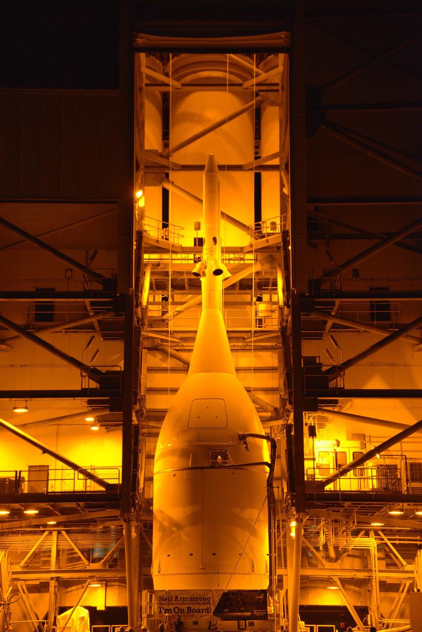 CAPE CANAVERAL, Fla. – At Cape Canaveral Air Force Station's Launch Complex 37, United Launch Alliance engineers and technicians prepare to lift the agency's Orion spacecraft for mounting atop its Delta IV Heavy rocket.    Orion is the exploration spacecraft designed to carry astronauts to destinations not yet explored by humans, including an asteroid and Mars. It will have emergency abort capability, sustain the crew during space travel and provide safe re-entry from deep space return velocities. The first unpiloted flight test of Orion is scheduled to launch Dec. 4, 2014 atop a United Launch Alliance Delta IV Heavy rocket, and in 2018 on NASA’s Space Launch System rocket. For more information, visit www.nasa.gov/orion Photo credit: NASA/Radislav Sinyak