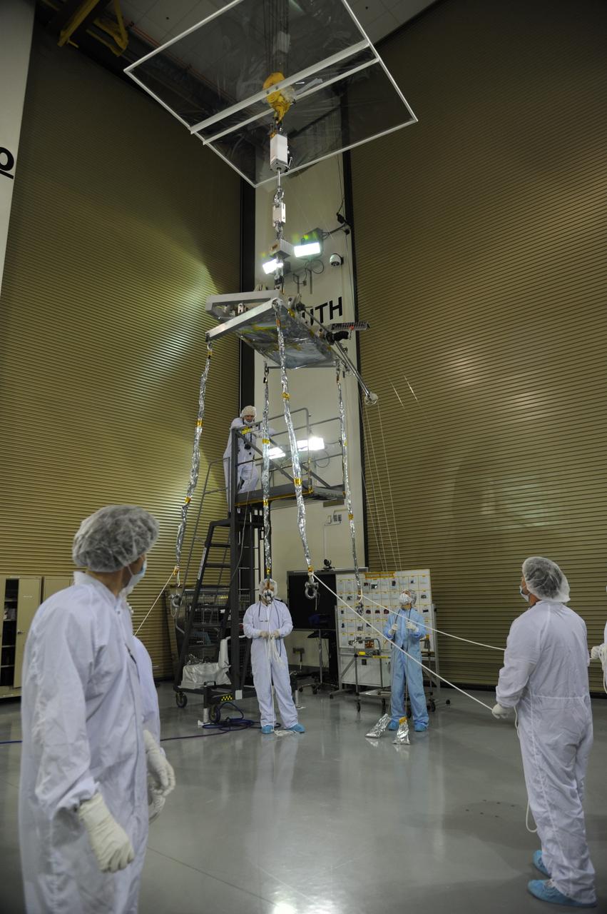 VANDENBERG AIR FORCE BASE, Calif. – Operations are underway to weigh NASA's Soil Moisture Active Passive, or SMAP, spacecraft in the clean room of the Astrotech payload processing facility on Vandenberg Air Force Base in California. The weighing of a spacecraft is standard procedure during prelaunch processing.      SMAP will launch on a Delta II 7320 configuration vehicle featuring a United Launch Alliance first stage booster powered by an Aerojet Rocketdyne RS-27A main engine and three Alliant Techsystems, or ATK, strap-on solid rocket motors. Once on station in Earth orbit, SMAP will provide global measurements of soil moisture and its freeze/thaw state. NASA's Jet Propulsion Laboratory that built the observatory and its radar instrument also is responsible for SMAP project management and mission operations.  Launch from Space Launch Complex 2 is targeted for Jan. 29, 2015. To learn more about SMAP, visit http://smap.jpl.nasa.gov.  Photo credit: NASA/Randy Beaudoin