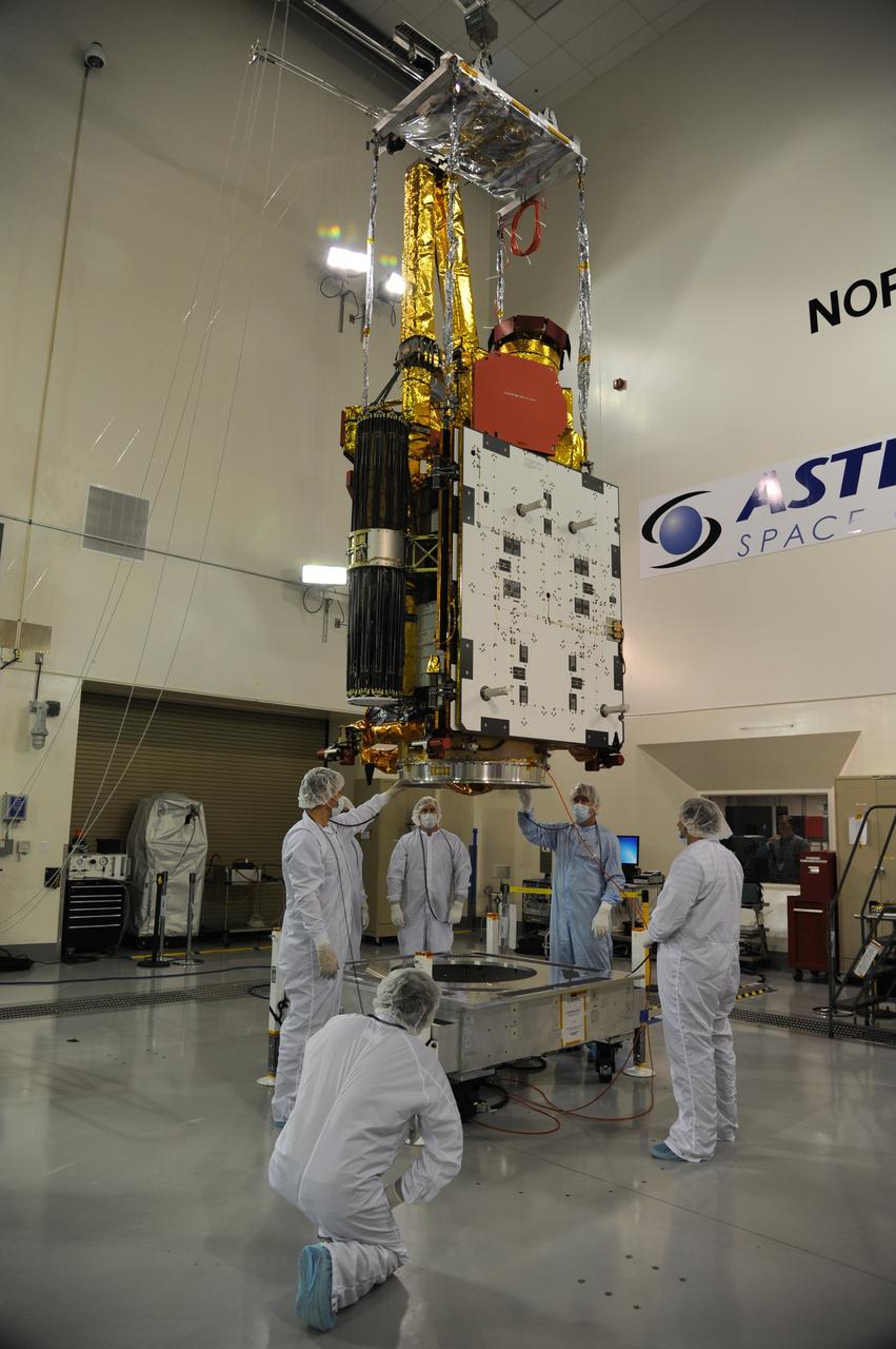 VANDENBERG AIR FORCE BASE, Calif. – NASA's Soil Moisture Active Passive, or SMAP, spacecraft is lifted from its workstand in the clean room of the Astrotech payload processing facility on Vandenberg Air Force Base in California during operations to determine its weight. The weighing of a spacecraft is standard procedure during prelaunch processing.    SMAP will launch on a Delta II 7320 configuration vehicle featuring a United Launch Alliance first stage booster powered by an Aerojet Rocketdyne RS-27A main engine and three Alliant Techsystems, or ATK, strap-on solid rocket motors. Once on station in Earth orbit, SMAP will provide global measurements of soil moisture and its freeze/thaw state. NASA's Jet Propulsion Laboratory that built the observatory and its radar instrument also is responsible for SMAP project management and mission operations.  Launch from Space Launch Complex 2 is targeted for Jan. 29, 2015. To learn more about SMAP, visit http://smap.jpl.nasa.gov.  Photo credit: NASA/Randy Beaudoin