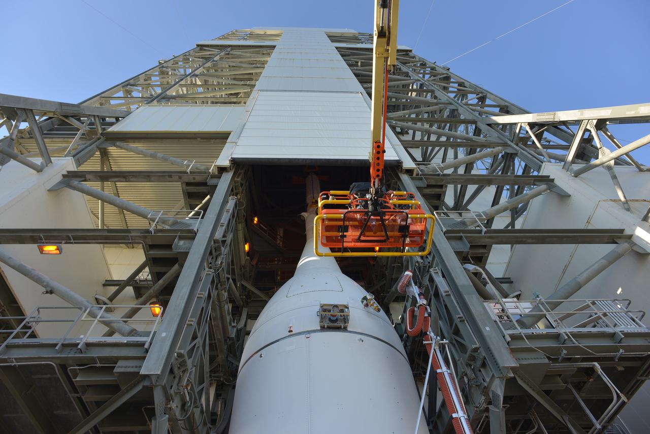 CAPE CANAVERAL, Fla. – At Cape Canaveral Air Force Station's Launch Complex 37, United Launch Alliance engineers and technicians prepare to lift the agency's Orion spacecraft for mounting atop its Delta IV Heavy rocket.    Orion is the exploration spacecraft designed to carry astronauts to destinations not yet explored by humans, including an asteroid and Mars. It will have emergency abort capability, sustain the crew during space travel and provide safe re-entry from deep space return velocities. The first unpiloted flight test of Orion is scheduled to launch Dec. 4, 2014 atop a United Launch Alliance Delta IV Heavy rocket, and in 2018 on NASA’s Space Launch System rocket. For more information, visit www.nasa.gov/orion Photo credit: NASA/Radislav Sinyak