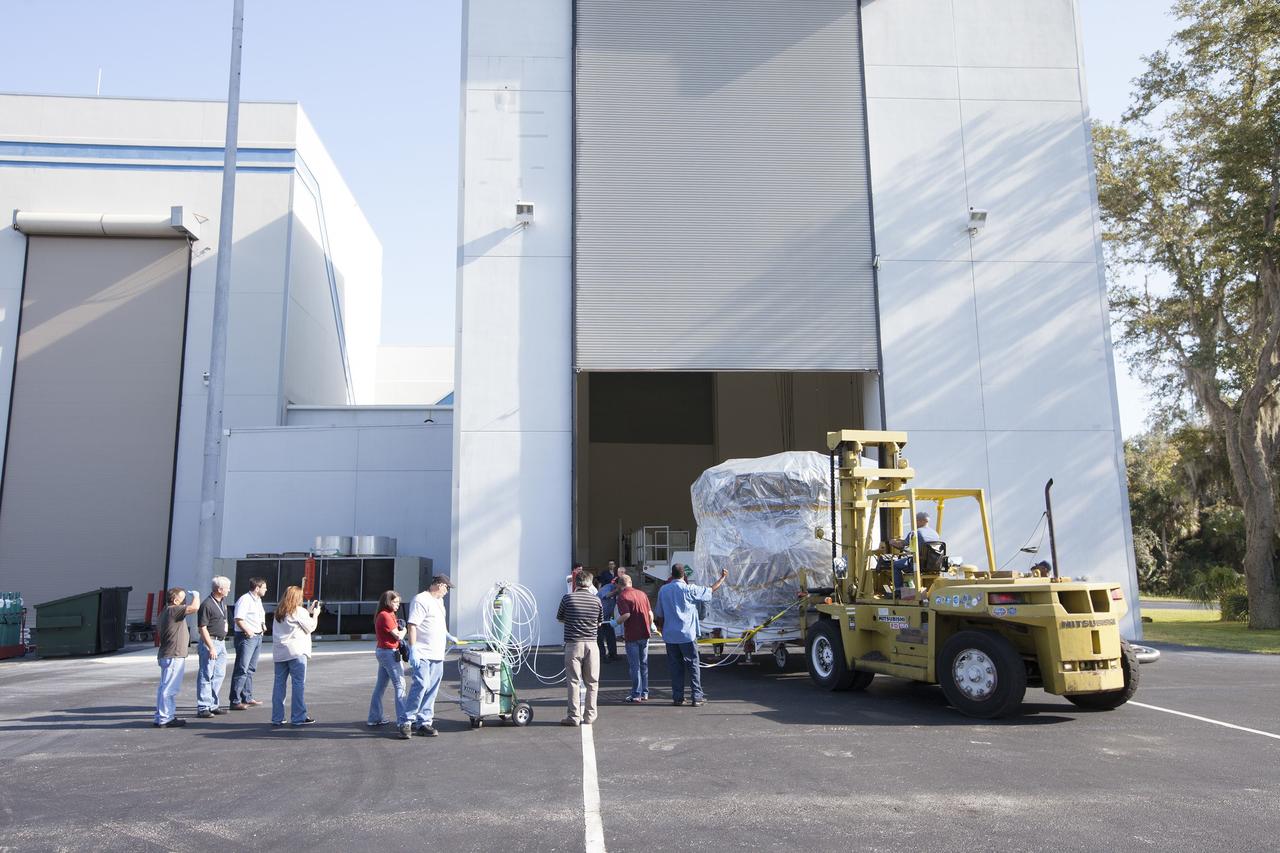 CAPE CANAVERAL, Fla. – Two Magnetospheric Multiscale, or MMS, spacecraft comprising the mission’s upper stack are towed from Building 2 to the Building 1 high bay of the Astrotech payload processing facility in Titusville, Florida, near Kennedy Space Center. The two MMS spacecraft comprising the lower stack arrived at Astrotech on Oct. 29. The Magnetospheric Multiscale mission is a Solar Terrestrial Probes mission comprising four identically instrumented spacecraft that will use Earth’s magnetosphere as a laboratory to study the microphysics of three fundamental plasma processes: magnetic reconnection, energetic particle acceleration and turbulence. Launch aboard a United Launch Alliance Atlas V rocket from Space Launch Complex 41 on Cape Canaveral Air Force Station is targeted for March 12, 2015. To learn more about MMS, visit http://mms.gsfc.nasa.gov.  Photo credit: NASA/Kim Shiflett