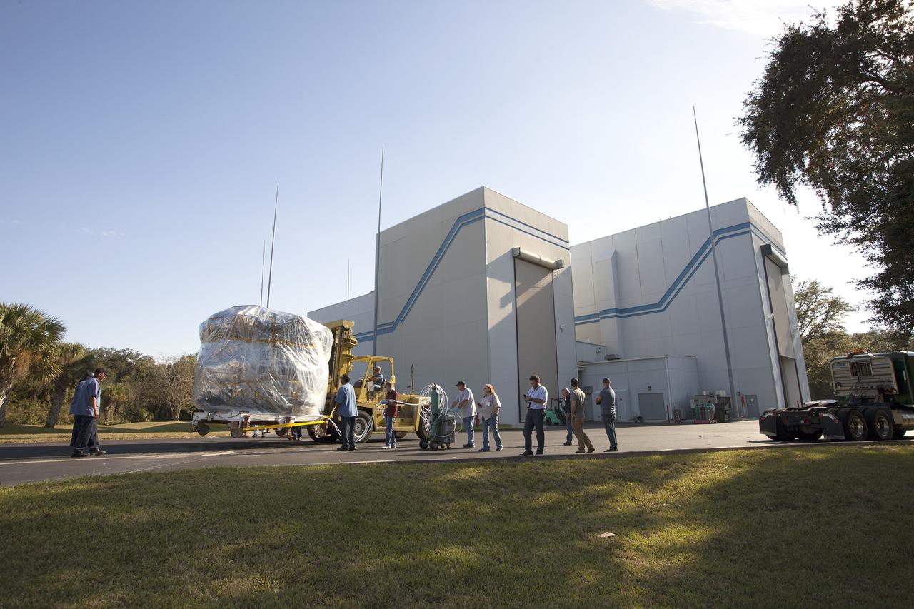 CAPE CANAVERAL, Fla. – Two Magnetospheric Multiscale, or MMS, spacecraft comprising the mission’s upper stack are towed between Buildings 1 and 2 of the Astrotech payload processing facility in Titusville, Florida, near Kennedy Space Center. The two MMS spacecraft comprising the lower stack arrived at Astrotech on Oct. 29. The Magnetospheric Multiscale mission is a Solar Terrestrial Probes mission comprising four identically instrumented spacecraft that will use Earth’s magnetosphere as a laboratory to study the microphysics of three fundamental plasma processes: magnetic reconnection, energetic particle acceleration and turbulence. Launch aboard a United Launch Alliance Atlas V rocket from Space Launch Complex 41 on Cape Canaveral Air Force Station is targeted for March 12, 2015. To learn more about MMS, visit http://mms.gsfc.nasa.gov.  Photo credit: NASA/Kim Shiflett