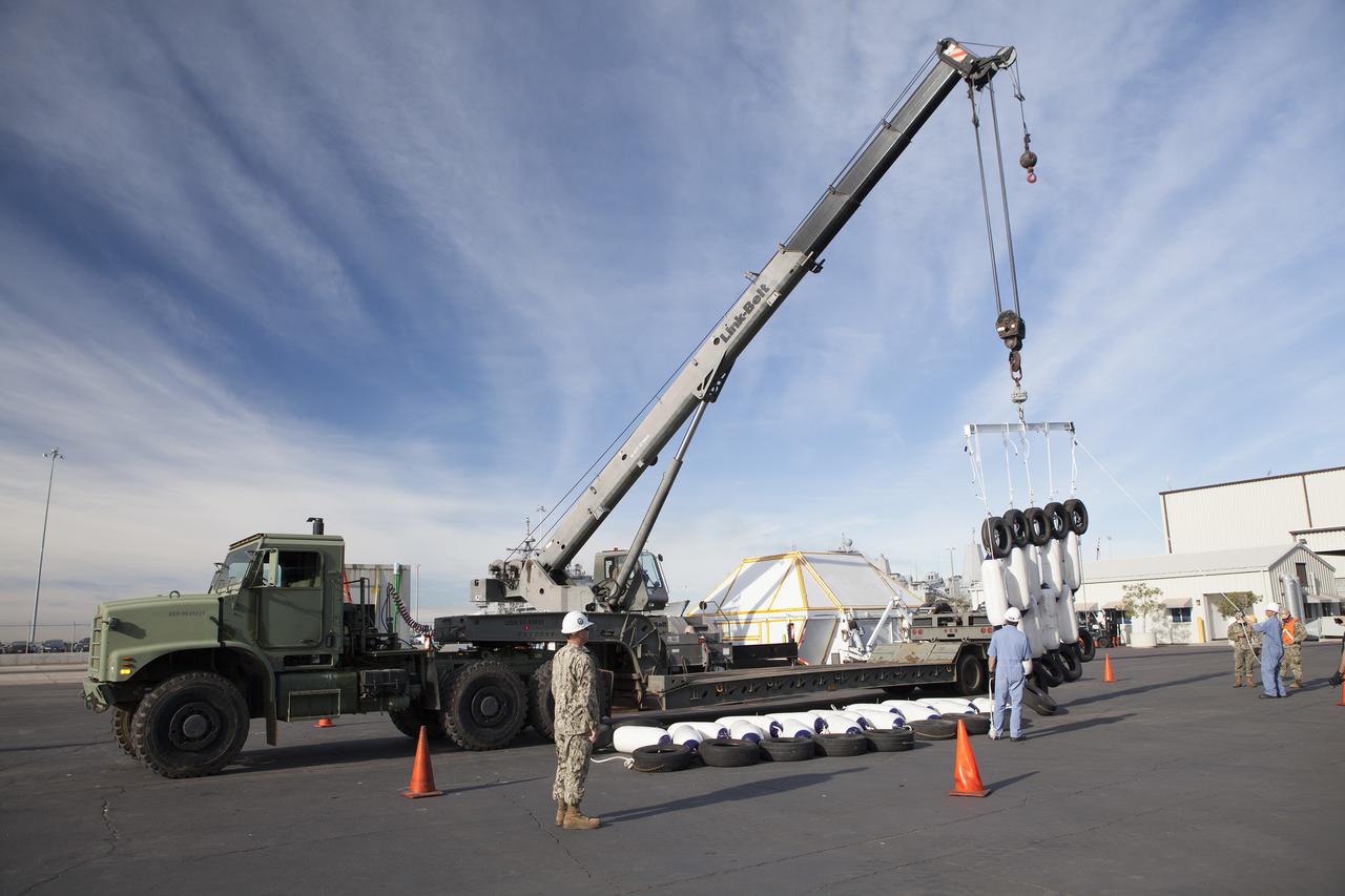 SAN DIEGO, Calif. – Ground support equipment for use during an alternate recovery method of the Orion crew module after its first flight test, if needed, is being prepared for loading onto the USNS Salvor, a salvage ship, at Naval Base San Diego in California. Before launch of Orion on a Delta IV Heavy rocket from Cape Canaveral Air Force Station in Florida, NASA, Lockheed Martin and U.S. Navy personnel will head out to sea in the USS Anchorage and the USNS Salvor and wait for splashdown of the Orion crew module in the Pacific Ocean. The GSDO Program will lead the recovery efforts. Orion is the exploration spacecraft designed to carry astronauts to destinations not yet explored by humans, including an asteroid and Mars. It will have emergency abort capability, sustain the crew during space travel and provide safe re-entry from deep space return velocities. The first unpiloted flight test of Orion is scheduled to launch in December atop a United Launch Alliance Delta IV Heavy rocket and in 2018 on NASA’s Space Launch System rocket. For more information, visit http://www.nasa.gov/orion. Photo credit: NASA/Dimitri Gerondidakis