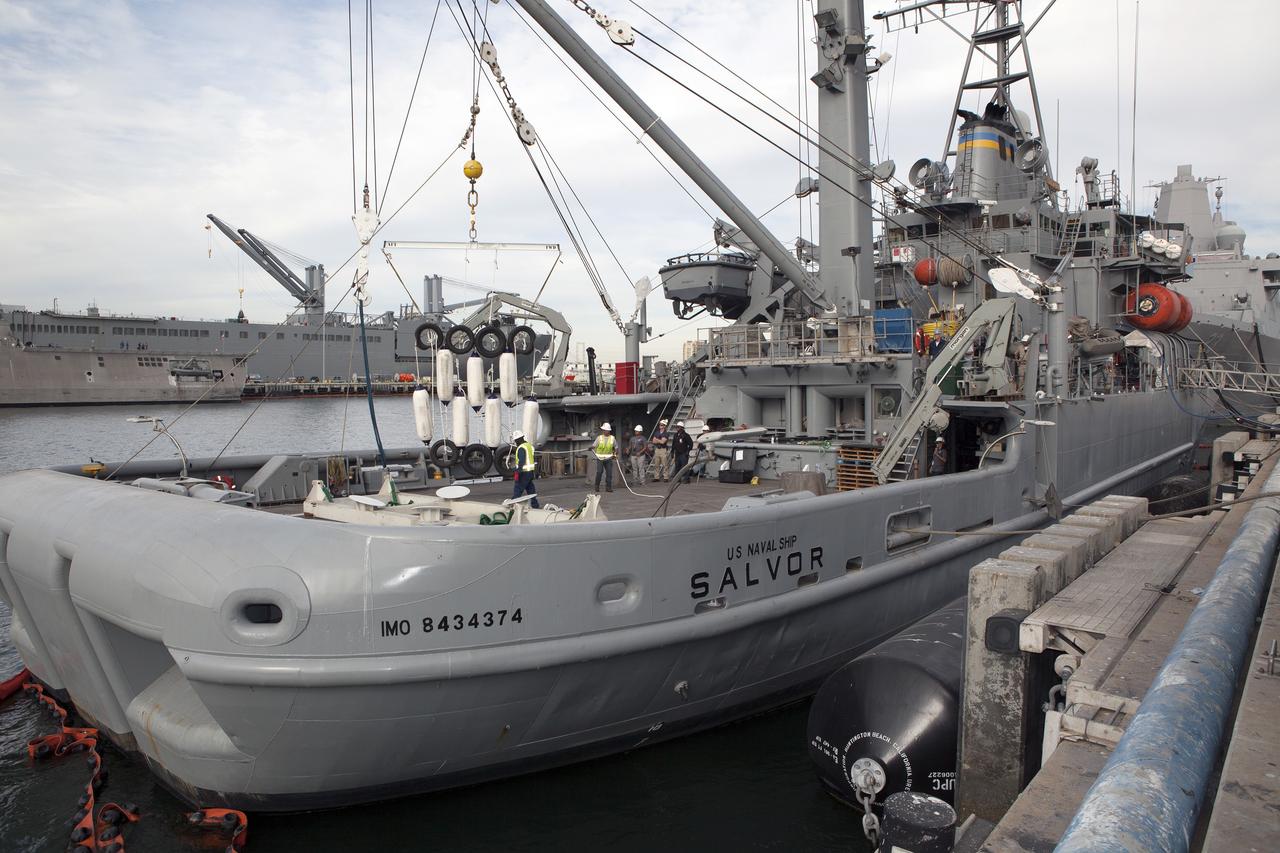 SAN DIEGO, Calif. – Ground support equipment for use during an alternate recovery method of the Orion crew module after its first flight test, if needed, is lowered by crane onto the deck of the USNS Salvor, a salvage ship, at Naval Base San Diego in California. Before launch of Orion on a Delta IV Heavy rocket from Cape Canaveral Air Force Station in Florida, NASA, Lockheed Martin and U.S. Navy personnel will head out to sea in the USS Anchorage and the USNS Salvor and wait for splashdown of the Orion crew module in the Pacific Ocean. The GSDO Program will lead the recovery efforts. Orion is the exploration spacecraft designed to carry astronauts to destinations not yet explored by humans, including an asteroid and Mars. It will have emergency abort capability, sustain the crew during space travel and provide safe re-entry from deep space return velocities. The first unpiloted flight test of Orion is scheduled to launch in December atop a United Launch Alliance Delta IV Heavy rocket and in 2018 on NASA’s Space Launch System rocket. For more information, visit http://www.nasa.gov/orion. Photo credit: NASA/Dimitri Gerondidakis