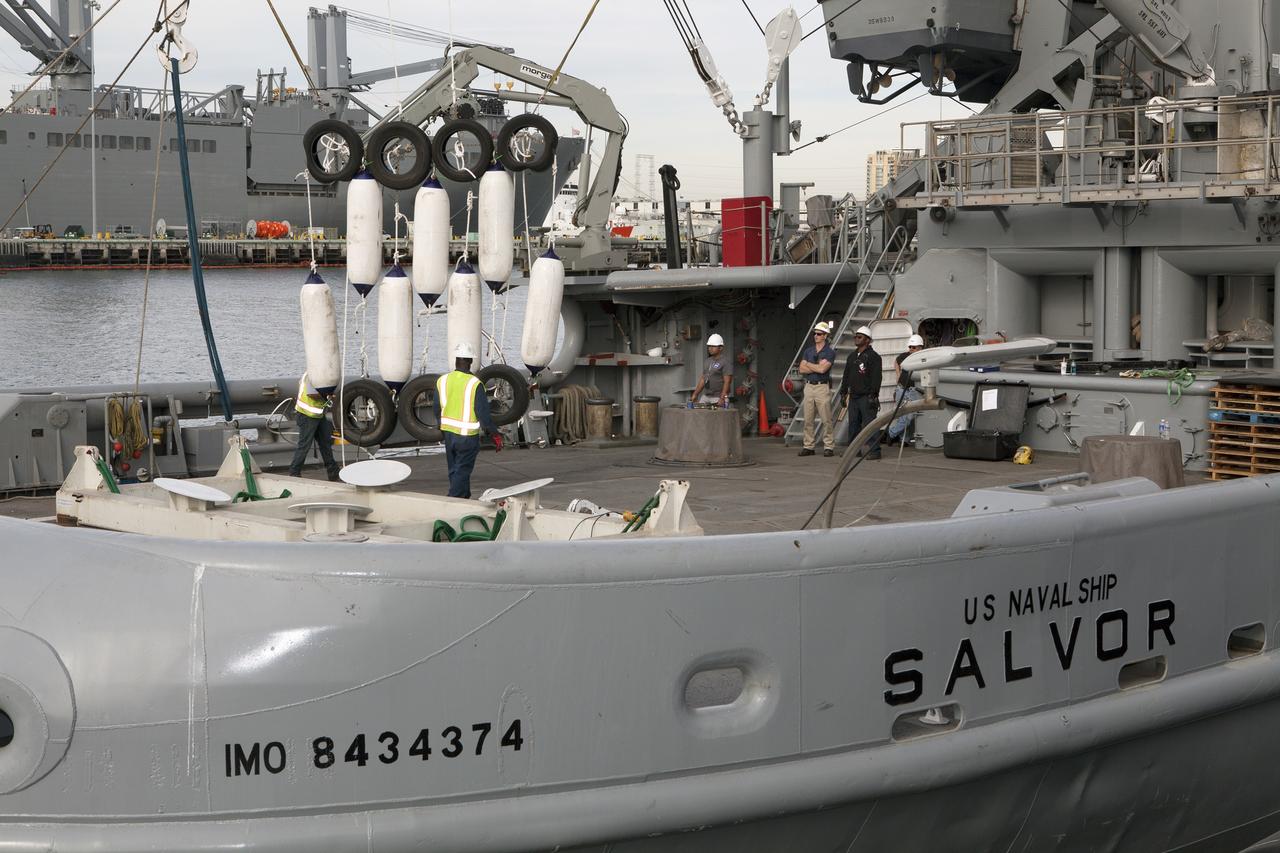 SAN DIEGO, Calif. – Ground support equipment for use during an alternate recovery method of the Orion crew module after its first flight test, if needed, is lowered by crane onto the deck of the USNS Salvor, a salvage ship, at Naval Base San Diego in California. Before launch of Orion on a Delta IV Heavy rocket from Cape Canaveral Air Force Station in Florida, NASA, Lockheed Martin and U.S. Navy personnel will head out to sea in the USS Anchorage and the USNS Salvor and wait for splashdown of the Orion crew module in the Pacific Ocean. The GSDO Program will lead the recovery efforts. Orion is the exploration spacecraft designed to carry astronauts to destinations not yet explored by humans, including an asteroid and Mars. It will have emergency abort capability, sustain the crew during space travel and provide safe re-entry from deep space return velocities. The first unpiloted flight test of Orion is scheduled to launch in December atop a United Launch Alliance Delta IV Heavy rocket and in 2018 on NASA’s Space Launch System rocket. For more information, visit http://www.nasa.gov/orion. Photo credit: NASA/Dimitri Gerondidakis