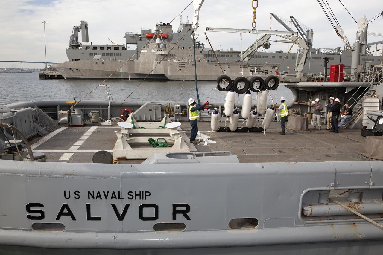 SAN DIEGO, Calif. – Ground support equipment for use during an alternate recovery method of the Orion crew module after its first flight test, if needed, is lowered by crane onto the deck of the USNS Salvor, a salvage ship, at Naval Base San Diego in California. Before launch of Orion on a Delta IV Heavy rocket from Cape Canaveral Air Force Station in Florida, NASA, Lockheed Martin and U.S. Navy personnel will head out to sea in the USS Anchorage and the USNS Salvor and wait for splashdown of the Orion crew module in the Pacific Ocean. The GSDO Program will lead the recovery efforts. Orion is the exploration spacecraft designed to carry astronauts to destinations not yet explored by humans, including an asteroid and Mars. It will have emergency abort capability, sustain the crew during space travel and provide safe re-entry from deep space return velocities. The first unpiloted flight test of Orion is scheduled to launch in December atop a United Launch Alliance Delta IV Heavy rocket and in 2018 on NASA’s Space Launch System rocket. For more information, visit http://www.nasa.gov/orion. Photo credit: NASA/Dimitri Gerondidakis