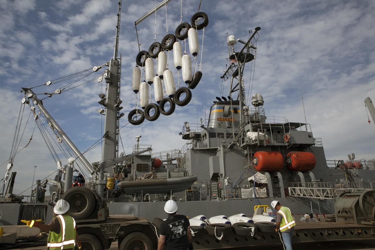 SAN DIEGO, Calif. – Ground support equipment for use during an alternate recovery method of the Orion crew module after its first flight test, if needed, is lowered by crane onto the deck of the USNS Salvor, a salvage ship, at Naval Base San Diego in California. Before launch of Orion on a Delta IV Heavy rocket from Cape Canaveral Air Force Station in Florida, NASA, Lockheed Martin and U.S. Navy personnel will head out to sea in the USS Anchorage and the USNS Salvor and wait for splashdown of the Orion crew module in the Pacific Ocean. The GSDO Program will lead the recovery efforts. Orion is the exploration spacecraft designed to carry astronauts to destinations not yet explored by humans, including an asteroid and Mars. It will have emergency abort capability, sustain the crew during space travel and provide safe re-entry from deep space return velocities. The first unpiloted flight test of Orion is scheduled to launch in December atop a United Launch Alliance Delta IV Heavy rocket and in 2018 on NASA’s Space Launch System rocket. For more information, visit http://www.nasa.gov/orion. Photo credit: NASA/Dimitri Gerondidakis