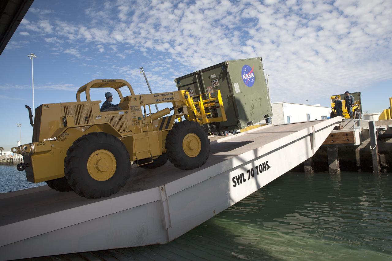 SAN DIEGO, Calif. – A forklift is used to carry ground support equipment into the well deck of the USS Anchorage at Naval Base San Diego in California. The equipment will be used during recovery of the Orion crew module after its first flight test. Before launch of Orion on a Delta IV Heavy rocket from Cape Canaveral Air Force Station in Florida, NASA, Lockheed Martin and U.S. Navy personnel will head out to sea in the USS Anchorage and the USNS Salvor, a salvage ship, and wait for splashdown of the Orion crew module in the Pacific Ocean. The Ground Systems Development and Operations Program will lead the recovery efforts. Orion is the exploration spacecraft designed to carry astronauts to destinations not yet explored by humans, including an asteroid and Mars. It will have emergency abort capability, sustain the crew during space travel and provide safe re-entry from deep space return velocities. The first unpiloted flight test of Orion is scheduled to launch in December atop a United Launch Alliance Delta IV Heavy rocket and in 2018 on NASA’s Space Launch System rocket. For more information, visit http://www.nasa.gov/orion. Photo credit: NASA/Dimitri Gerondidakis