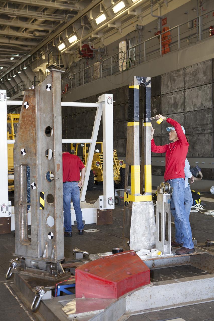 SAN DIEGO, Calif. – Ground support equipment is being secured in the well deck of the USS Anchorage at Naval Base San Diego in California. The equipment will be used during recovery of the Orion crew module after its first flight test. Before launch of Orion on a Delta IV Heavy rocket from Cape Canaveral Air Force Station in Florida, NASA, Lockheed Martin and U.S. Navy personnel will head out to sea in the USS Anchorage and the USNS Salvor, a salvage ship, and wait for splashdown of the Orion crew module in the Pacific Ocean. The Ground Systems Development and Operations Program will lead the recovery efforts. Orion is the exploration spacecraft designed to carry astronauts to destinations not yet explored by humans, including an asteroid and Mars. It will have emergency abort capability, sustain the crew during space travel and provide safe re-entry from deep space return velocities. The first unpiloted flight test of Orion is scheduled to launch in December atop a United Launch Alliance Delta IV Heavy rocket and in 2018 on NASA’s Space Launch System rocket. For more information, visit http://www.nasa.gov/orion. Photo credit: NASA/Dimitri Gerondidakis