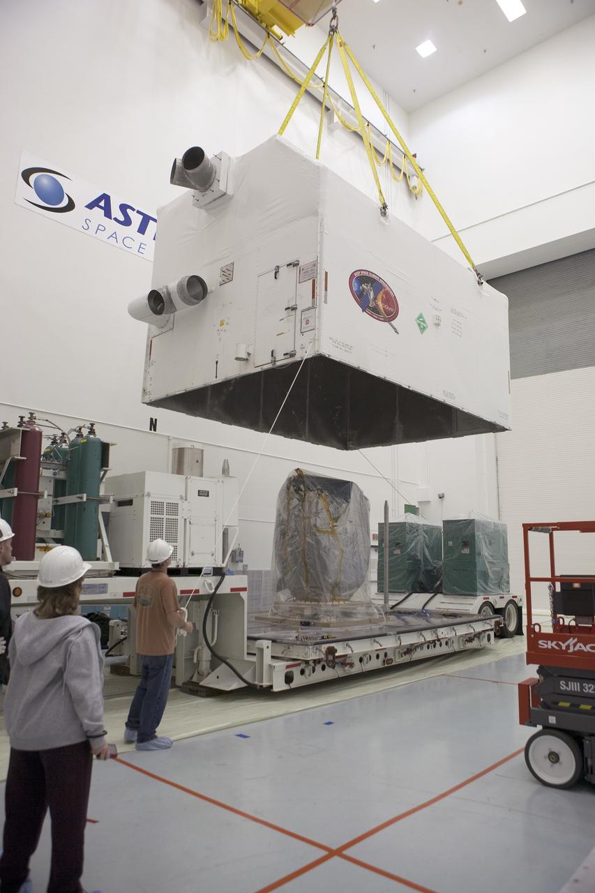 CAPE CANAVERAL, Fla. – NOAA’s Deep Space Climate Observatory spacecraft, or DSCOVR, wrapped in plastic, comes into view as the protective shipping container is lifted from around the spacecraft at the Astrotech payload processing facility in Titusville, Florida, near Kennedy Space Center. DSCOVR is a partnership between NOAA, NASA and the U.S. Air Force. DSCOVR will maintain the nation's real-time solar wind monitoring capabilities which are critical to the accuracy and lead time of NOAA's space weather alerts and forecasts. Launch is currently scheduled for January 2015 aboard a SpaceX Falcon 9 v 1.1 launch vehicle from Cape Canaveral Air Force Station, Florida. To learn more about DSCOVR, visit http://www.nesdis.noaa.gov/DSCOVR. Photo credit: NASA/Kim Shiflett