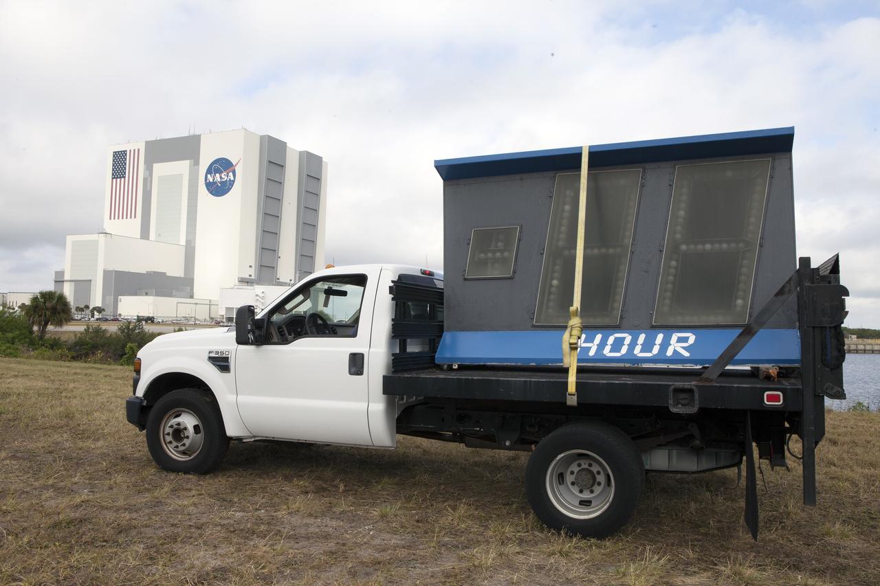CAPE CANAVERAL, Fla. – At NASA's Kennedy Space Center in Florida, the historic countdown clock at the spaceport's Press Site is disassembled for removal. Kennedy has requested to acquire the countdown clock from the agency’s Artifact Working Group at NASA Headquarters for likely display at the Kennedy Space Center Visitor Complex. A new modern multimedia display soon will be installed, similar to the screens seen at sporting venues, is in the works. The new screen will be nearly 26 feet wide by 7 feet high.     The old timepiece was designed by Kennedy engineers and built by Kennedy technicians in 1969. Not including the triangular concrete and aluminum base, the famous landmark is nearly six feet high, 26 feet wide and 3 feet deep. The new display will be similar in size, with the screen being nearly 26 feet wide by seven feet high. For more information on the countdown clock, go to http://go.nasa.gov/10Zku10. Photo credit: NASA/Frankie Martin