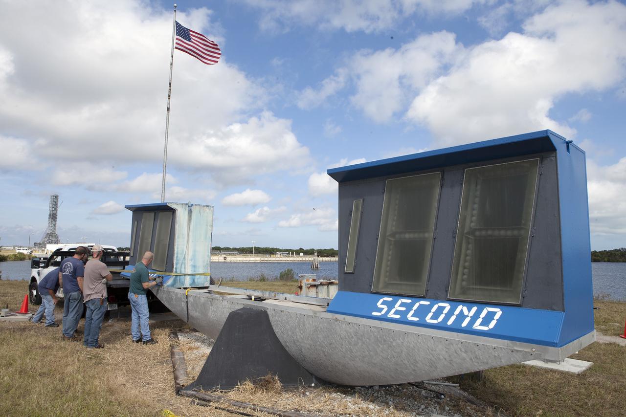 CAPE CANAVERAL, Fla. – At NASA's Kennedy Space Center in Florida, the historic countdown clock at the spaceport's Press Site is disassembled for removal. Kennedy has requested to acquire the countdown clock from the agency’s Artifact Working Group at NASA Headquarters for likely display at the Kennedy Space Center Visitor Complex. A new modern multimedia display soon will be installed, similar to the screens seen at sporting venues, is in the works. The new screen will be nearly 26 feet wide by 7 feet high. The old timepiece was designed by Kennedy engineers and built by Kennedy technicians in 1969. Not including the triangular concrete and aluminum base, the famous landmark is nearly six feet high, 26 feet wide and 3 feet deep. The new display will be similar in size, with the screen being nearly 26 feet wide by seven feet high. For more information on the countdown clock, go to http://go.nasa.gov/10Zku10. Photo credit: NASA/Frankie Martin