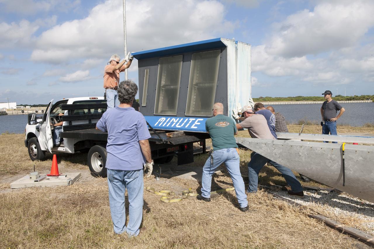 CAPE CANAVERAL, Fla. – At NASA's Kennedy Space Center in Florida, the historic countdown clock at the spaceport's Press Site is disassembled for removal. Kennedy has requested to acquire the countdown clock from the agency’s Artifact Working Group at NASA Headquarters for likely display at the Kennedy Space Center Visitor Complex. A new modern multimedia display soon will be installed, similar to the screens seen at sporting venues, is in the works. The new screen will be nearly 26 feet wide by 7 feet high.     The old timepiece was designed by Kennedy engineers and built by Kennedy technicians in 1969. Not including the triangular concrete and aluminum base, the famous landmark is nearly six feet high, 26 feet wide and 3 feet deep. The new display will be similar in size, with the screen being nearly 26 feet wide by seven feet high. For more information on the countdown clock, go to http://go.nasa.gov/10Zku10. Photo credit: NASA/Frankie Martin