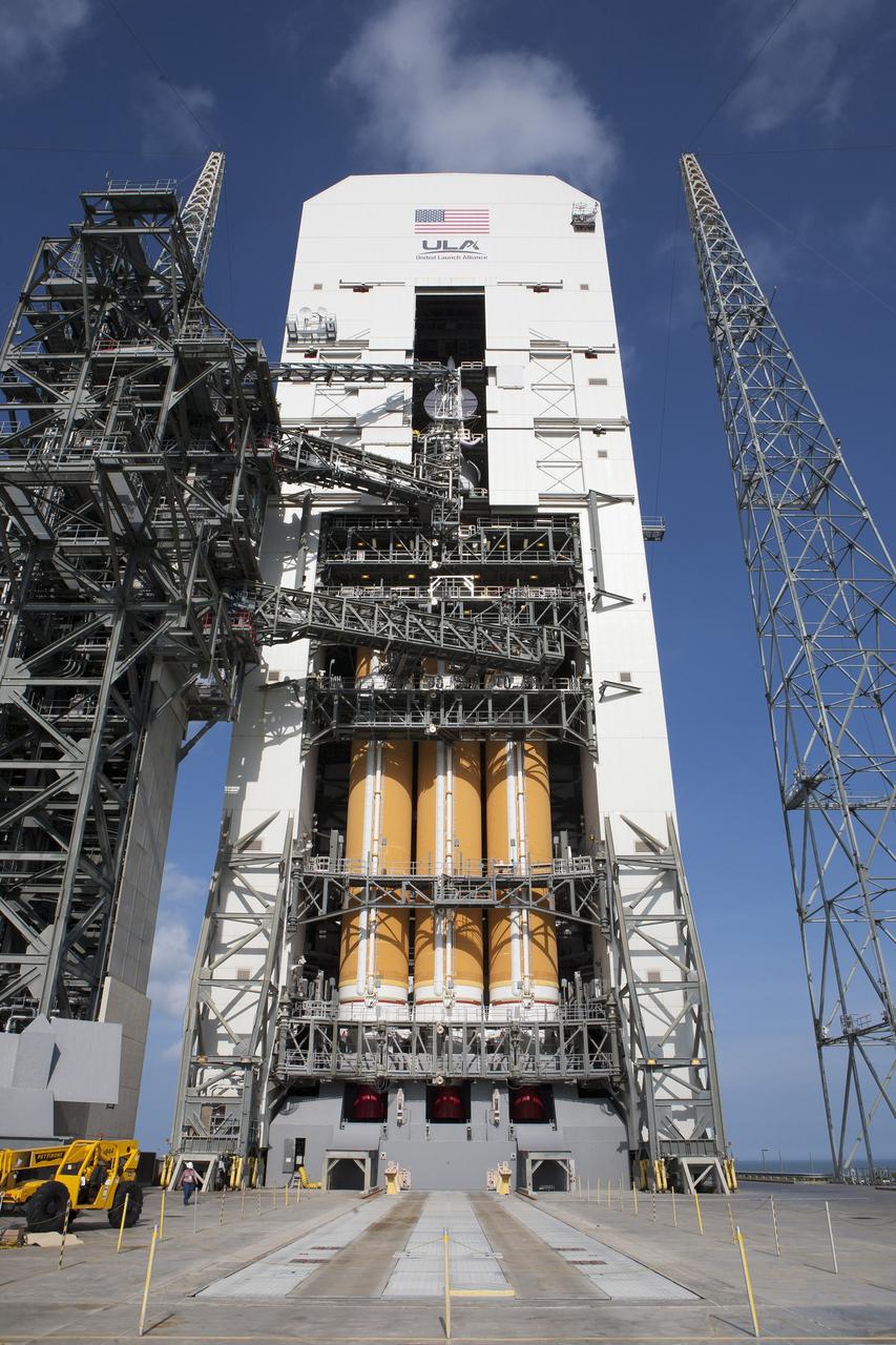 CAPE CANAVERAL, Fla. – With access doors at Space Launch Complex 37 opened, the Orion and Delta IV Heavy stack is visible in its entirety inside the Mobile Service Tower where the vehicle is undergoing launch preparations. Orion will make its first flight test on Dec. 4 with a morning launch atop the United Launch Alliance Delta IV Heavy. The spacecraft will orbit the Earth twice, including one loop that will reach 3,600 miles above Earth. No one will be aboard Orion for this flight test, but the spacecraft is being designed and built to carry astronauts to deep space destinations such as an asteroid. Photo credit: NASA/Kim Shiflett