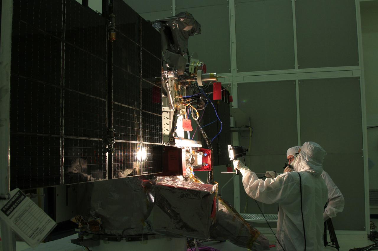 CAPE CANAVERAL, Fla. – Workers conduct a light test on the solar arrays on NOAA’s Deep Space Climate Observatory spacecraft, or DSCOVR, in the Building 1 high bay at the Astrotech payload processing facility in Titusville, Florida, near Kennedy Space Center. DSCOVR is a partnership between NOAA, NASA and the U.S. Air Force. DSCOVR will maintain the nation's real-time solar wind monitoring capabilities which are critical to the accuracy and lead time of NOAA's space weather alerts and forecasts. Launch is targeted for early 2015 aboard a SpaceX Falcon 9 v 1.1 launch vehicle from Cape Canaveral Air Force Station, Florida. To learn more about DSCOVR, visit http://www.nesdis.noaa.gov/DSCOVR. Photo credit: NASA/Ben Smegelsky