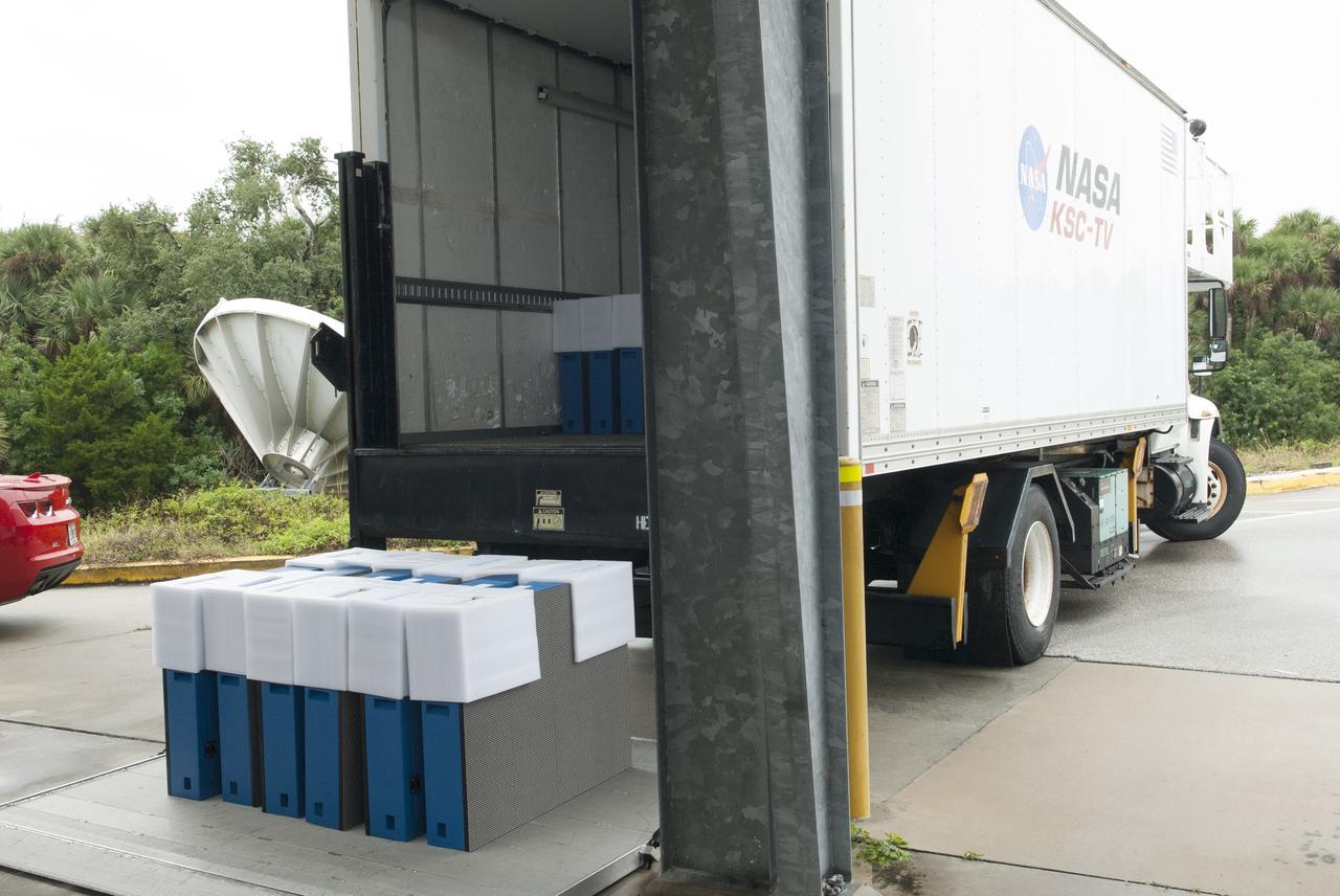 CAPE CANAVERAL, Fla. – At NASA's Kennedy Space Center in Florida, the first of 24 light emitting diode LED panels have arrived for installation in the new countdown clock at the spaceport's Press Site. A new modern, multimedia display soon will be installed, similar to the screens seen at sporting venues. The new screen will be nearly 26 feet wide by 7 feet high, a foot taller than the original clock.    The historic countdown clock was designed by Kennedy engineers and built by space center technicians before Apollo 12 in 1969. NASA has requested to acquire the countdown clock from the agency’s Artifact Working Group at the agency's Headquarters for likely display at the Kennedy Space Center Visitor Complex. For more information on the countdown clock, go to http://go.nasa.gov/10Zku10. Photo credit: NASA/Jim Grossmann