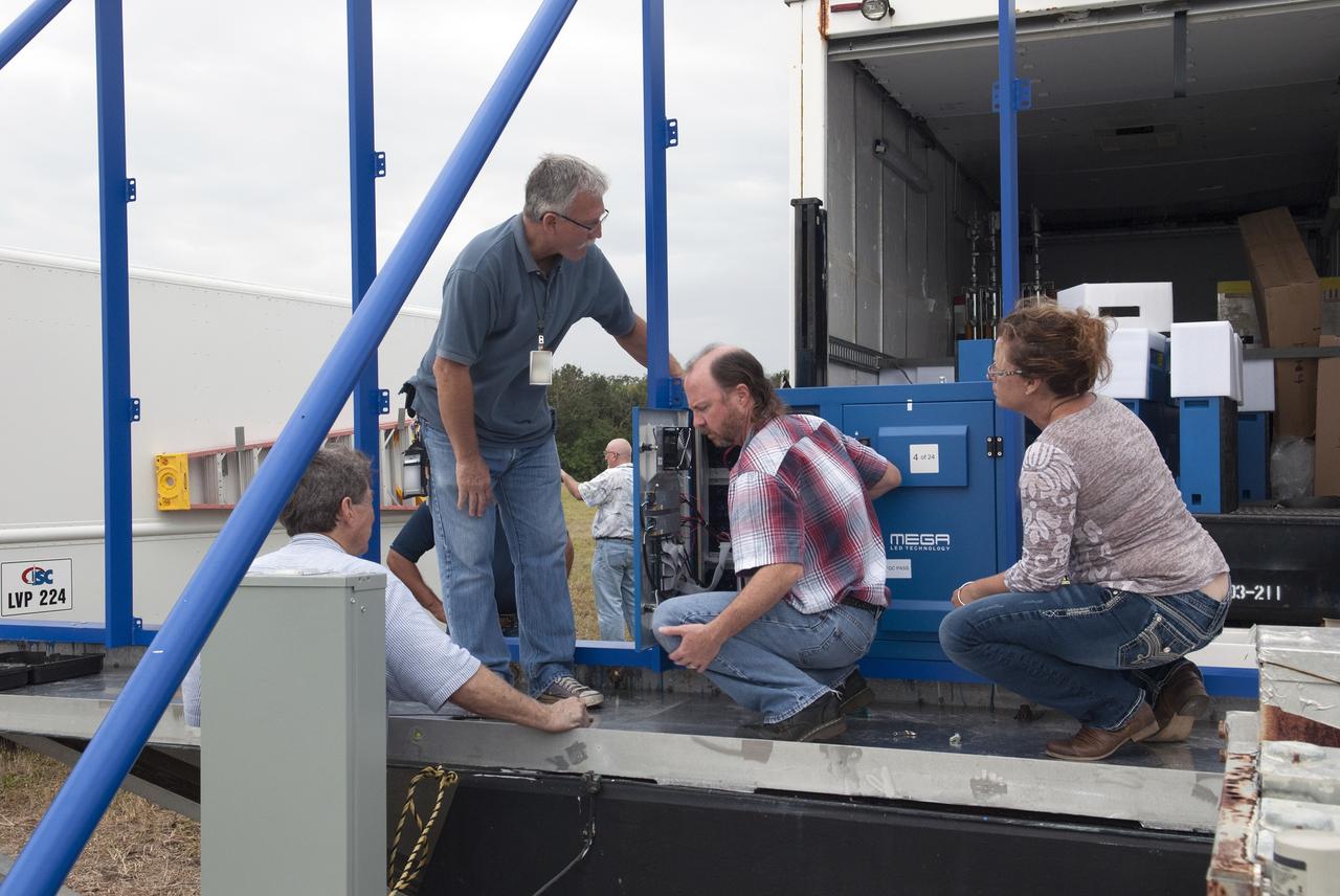 CAPE CANAVERAL, Fla. – At NASA's Kennedy Space Center in Florida, assembly has begun on the first of 24 light emitting diode LED panels for installation in the new countdown clock at the spaceport's Press Site. The new modern, multimedia display will be similar to the screens seen at sporting venues. The new screen will be nearly 26 feet wide by 7 feet high, a foot taller than the original clock.    The historic countdown clock was designed by Kennedy engineers and built by space center technicians before Apollo 12 in 1969. NASA has requested to acquire the countdown clock from the agency’s Artifact Working Group at the agency's Headquarters for likely display at the Kennedy Space Center Visitor Complex. For more information on the countdown clock, go to http://go.nasa.gov/10Zku10. Photo credit: NASA/Jim Grossmann