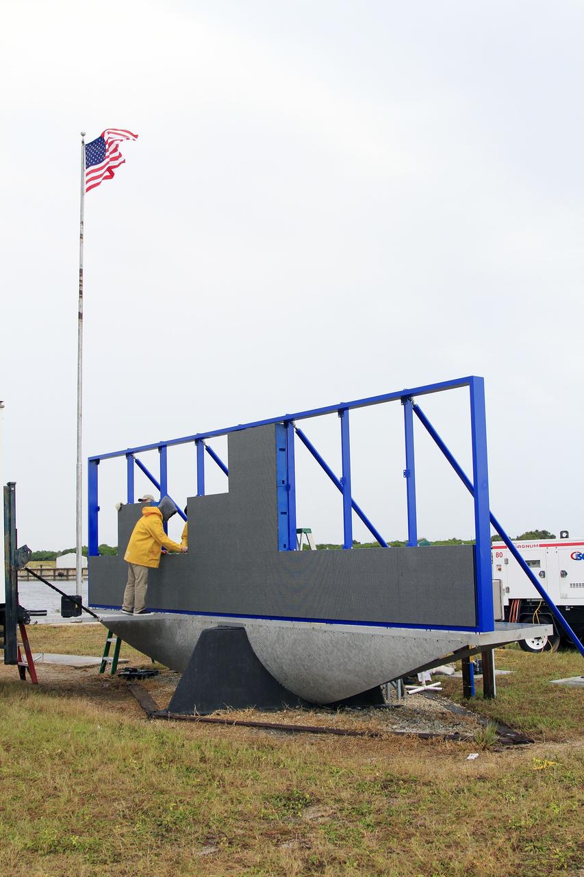 CAPE CANAVERAL, Fla. – At NASA's Kennedy Space Center in Florida, work continues to install 24 light emitting diode LED panels in the new countdown clock at the spaceport's Press Site. The modern, multimedia display is similar to the screens seen at sporting venues. The new screen will be nearly 26 feet wide by 7 feet high, a foot taller than the original clock.    The historic countdown clock was designed by Kennedy engineers and built by space center technicians before Apollo 12 in 1969. NASA has requested to acquire the countdown clock from the agency’s Artifact Working Group at the agency's Headquarters for likely display at the Kennedy Space Center Visitor Complex. For more information on the countdown clock, go to http://go.nasa.gov/10Zku10. Photo credit: NASA/Cory Huston