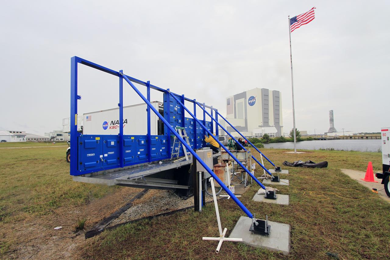 CAPE CANAVERAL, Fla. – At NASA's Kennedy Space Center in Florida, work continues to install 24 light emitting diode LED panels in the new countdown clock at the spaceport's Press Site. The modern, multimedia display is similar to the screens seen at sporting venues. The new screen will be nearly 26 feet wide by 7 feet high, a foot taller than the original clock.    The historic countdown clock was designed by Kennedy engineers and built by space center technicians before Apollo 12 in 1969. NASA has requested to acquire the countdown clock from the agency’s Artifact Working Group at the agency's Headquarters for likely display at the Kennedy Space Center Visitor Complex. For more information on the countdown clock, go to http://go.nasa.gov/10Zku10. Photo credit: NASA/Cory Huston