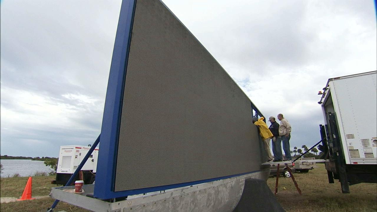 CAPE CANAVERAL, Fla. – At NASA's Kennedy Space Center in Florida, work continues to install 24 light emitting diode LED panels in the new countdown clock at the spaceport's Press Site. The modern, multimedia display is similar to the screens seen at sporting venues. The new screen will be nearly 26 feet wide by 7 feet high, a foot taller than the original clock.    The historic countdown clock was designed by Kennedy engineers and built by space center technicians before Apollo 12 in 1969. NASA has requested to acquire the countdown clock from the agency’s Artifact Working Group at the agency's Headquarters for display at the Kennedy Space Center Visitor Complex. For more information on the countdown clock, go to http://go.nasa.gov/10Zku10. Photo credit: NASA/Ben Smegelsky
