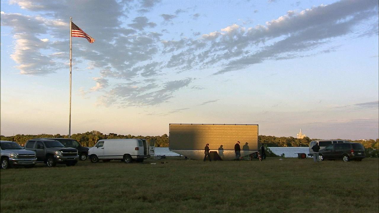 CAPE CANAVERAL, Fla. – At NASA's Kennedy Space Center in Florida, the new countdown clock at the spaceport's Press Site is being tested. The modern, multimedia display is similar to the screens seen at sporting venues. The new screen will be nearly 26 feet wide by 7 feet high, a foot taller than the original clock. The historic countdown clock was designed by Kennedy engineers and built by space center technicians before Apollo 12 in 1969. NASA has requested to acquire the countdown clock from the agency’s Artifact Working Group at the agency's Headquarters for display at the Kennedy Space Center Visitor Complex. For more information on the countdown clock, go to http://go.nasa.gov/10Zku10. Photo credit: NASA/Ben Smegelsky