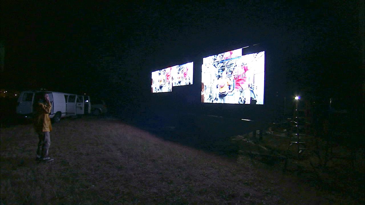 CAPE CANAVERAL, Fla. – At NASA's Kennedy Space Center in Florida, the new countdown clock at the spaceport's Press Site is being tested. The modern, multimedia display is similar to the screens seen at sporting venues. The new screen will be nearly 26 feet wide by 7 feet high, a foot taller than the original clock. The historic countdown clock was designed by Kennedy engineers and built by space center technicians before Apollo 12 in 1969. NASA has requested to acquire the countdown clock from the agency’s Artifact Working Group at the agency's Headquarters for display at the Kennedy Space Center Visitor Complex. For more information on the countdown clock, go to http://go.nasa.gov/10Zku10. Photo credit: NASA/Ben Smegelsky