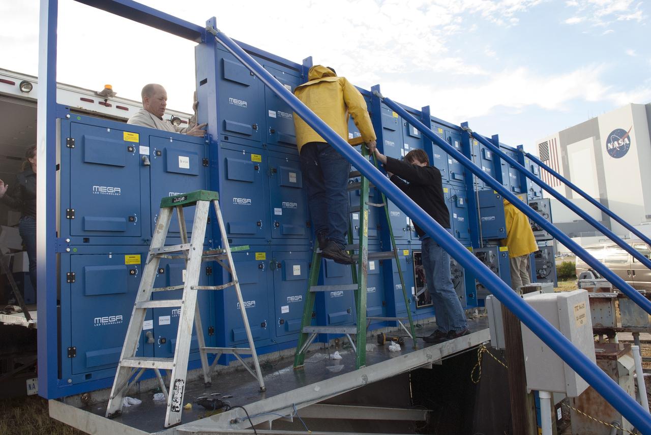 CAPE CANAVERAL, Fla. – At NASA's Kennedy Space Center in Florida, work continues to install 24 light emitting diode LED panels in the new countdown clock at the spaceport's Press Site. The modern, multimedia display is similar to the screens seen at sporting venues. The new screen will be nearly 26 feet wide by 7 feet high, a foot taller than the original clock.    The historic countdown clock was designed by Kennedy engineers and built by space center technicians before Apollo 12 in 1969. NASA has requested to acquire the countdown clock from the agency’s Artifact Working Group at the agency's Headquarters for display at the Kennedy Space Center Visitor Complex. For more information on the countdown clock, go to http://go.nasa.gov/10Zku10. Photo credit: NASA/Jim Grossman