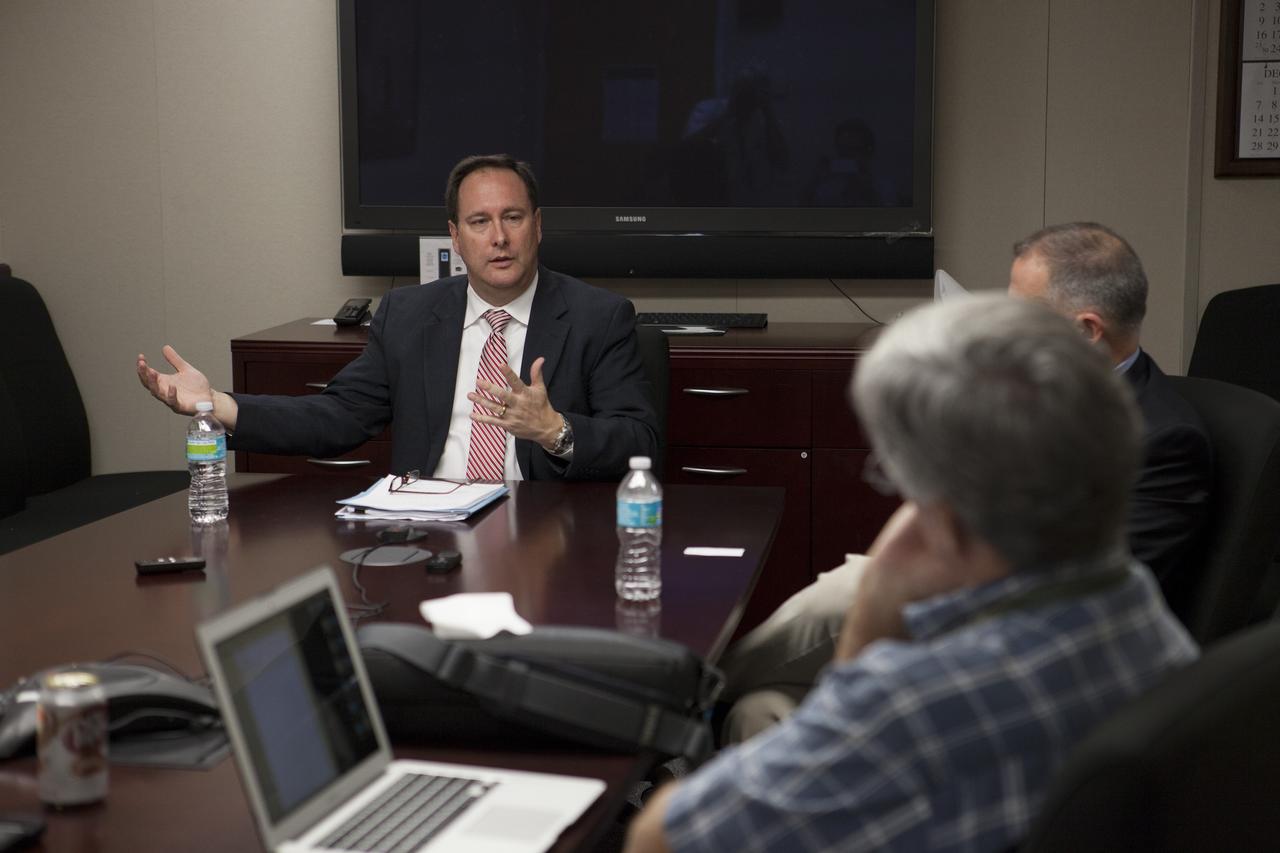 CAPE CANAVERAL, Fla. – NASA Associate Administrator Robert Lightfoot briefs journalists on the Asteroid Redirect Mission during a roundtable discussion at the agency's Kennedy Space Center in Florida. For more information on NASA's Asteroid Initiative, visit http://www.nasa.gov/asteroidinitiative. Photo credit: NASA/Kim Shiflett