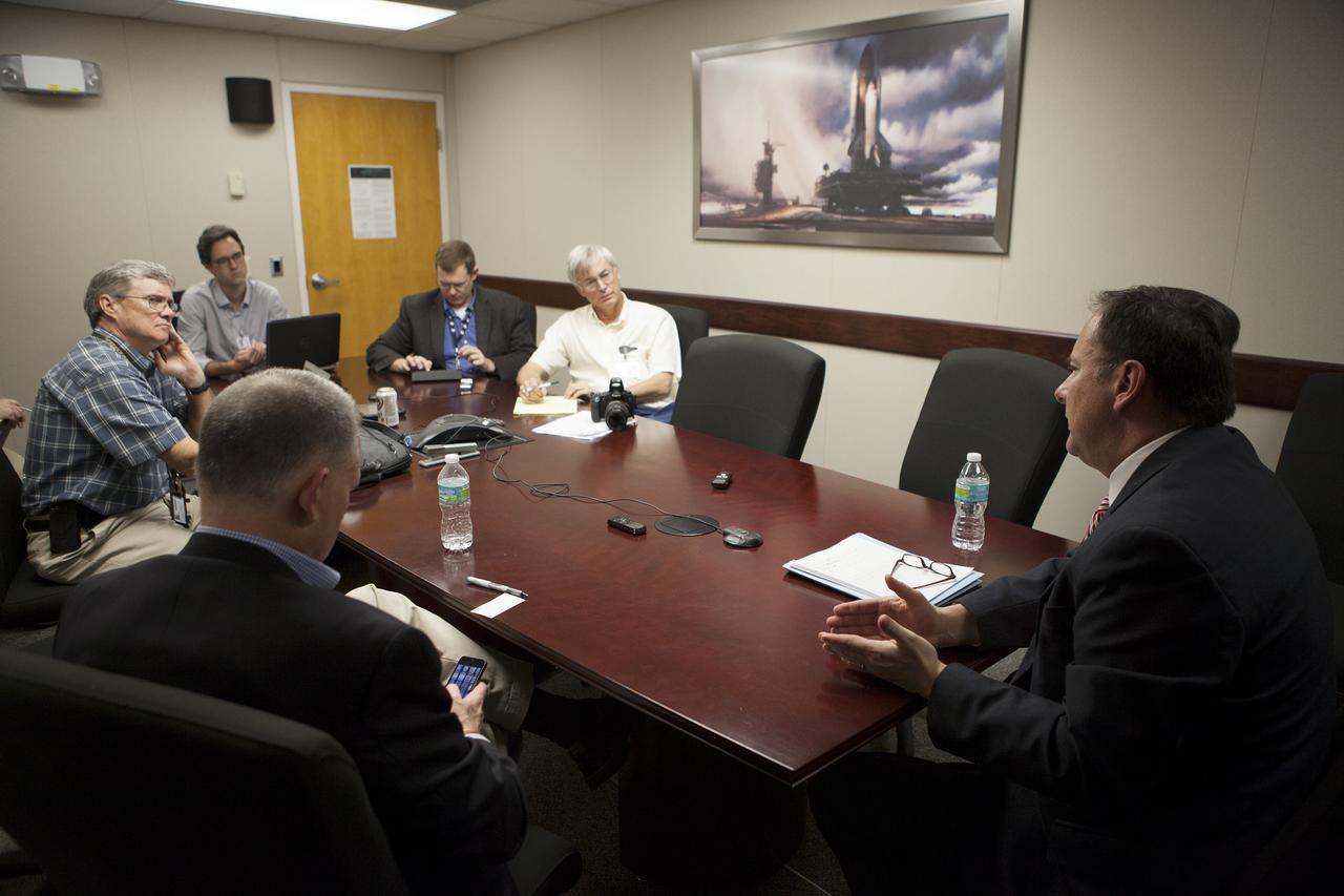CAPE CANAVERAL, Fla. – Journalists listen as NASA Associate Administrator Robert Lightfoot provides an on the Asteroid Redirect Mission during a roundtable discussion at the agency's Kennedy Space Center in Florida. For more information on NASA's Asteroid Initiative, visit http://www.nasa.gov/asteroidinitiative. Photo credit: NASA/Kim Shiflett