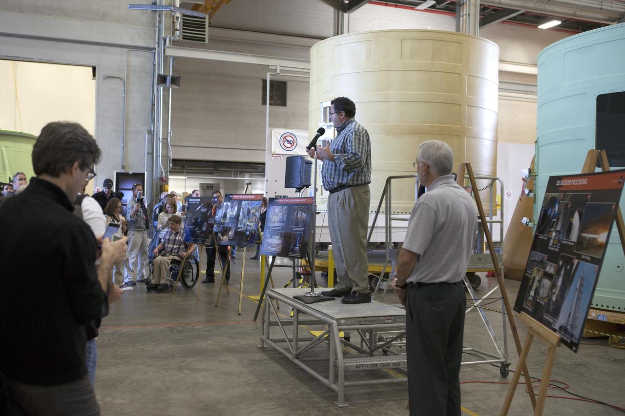 CAPE CANAVERAL, Fla. – At NASA's Kennedy Space Center in Florida, members of the news media are briefed on the agency's Space Launch System SLS Program Todd May, program manager for Space Launch Systems SLS at NASA's Marshall Space Flight Center in Huntsville, Alabama. The briefing took place in the spaceport's Booster Fabrication Facility BFF. During the Space Shuttle Program, the facility was used for processing forward segments and aft skirts for the solid rocket boosters. The BFF will serve a similar role for the SLS.      Orion is the exploration spacecraft designed to carry astronauts to destinations not yet explored by humans, including an asteroid and Mars. It will have emergency abort capability, sustain the crew during space travel and provide safe re-entry from deep space return velocities. The first unpiloted flight test of Orion is scheduled to launch Dec. 4, 2014 atop a United Launch Alliance Delta IV Heavy rocket, and in 2018 on NASA’s Space Launch System rocket. For more information, visit www.nasa.gov/orion Photo credit: NASA/Kim Shiflett