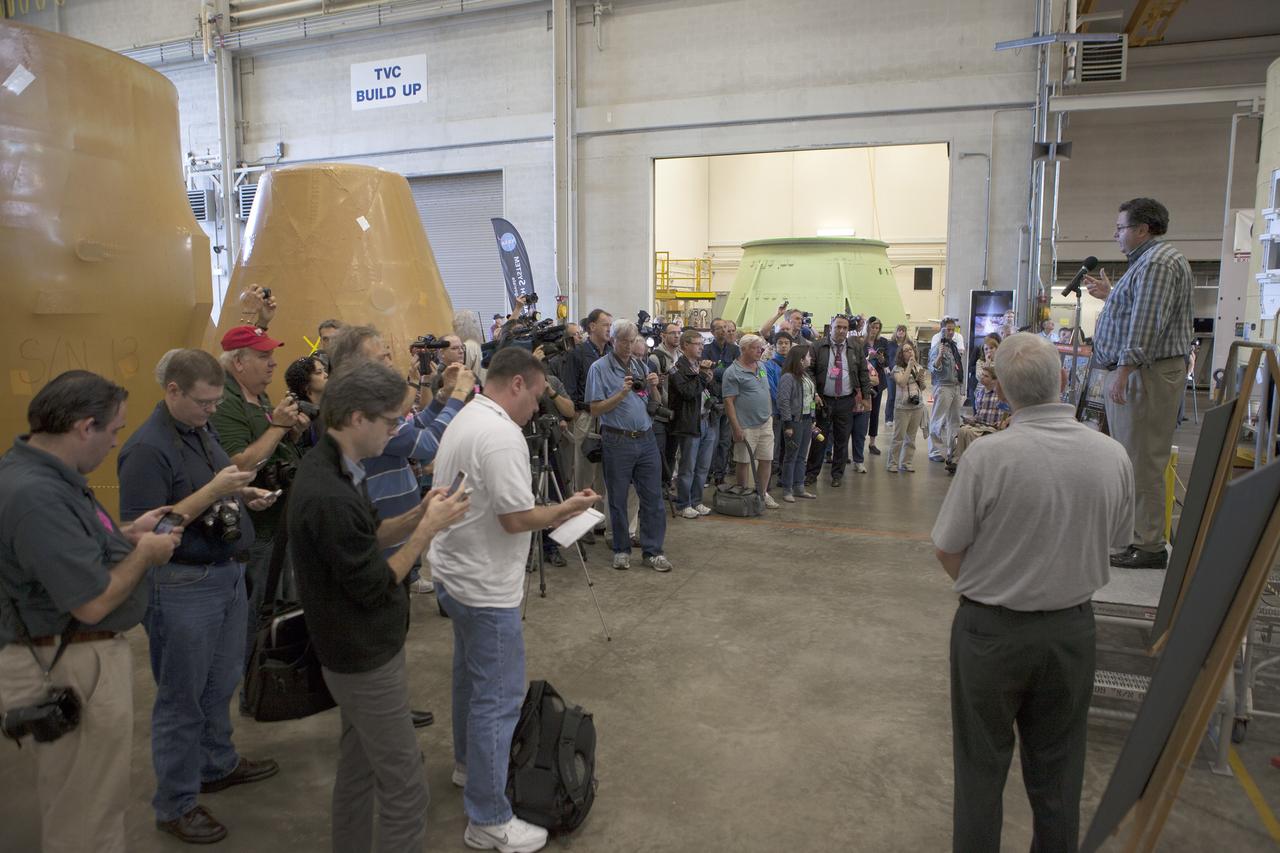 CAPE CANAVERAL, Fla. – At NASA's Kennedy Space Center in Florida, members of the news media are briefed on the agency's Space Launch System SLS Program Todd May, program manager for Space Launch Systems SLS at NASA's Marshall Space Flight Center in Huntsville, Alabama. The briefing took place in the spaceport's Booster Fabrication Facility BFF. During the Space Shuttle Program, the facility was used for processing forward segments and aft skirts for the solid rocket boosters. The BFF will serve a similar role for the SLS.      Orion is the exploration spacecraft designed to carry astronauts to destinations not yet explored by humans, including an asteroid and Mars. It will have emergency abort capability, sustain the crew during space travel and provide safe re-entry from deep space return velocities. The first unpiloted flight test of Orion is scheduled to launch Dec. 4, 2014 atop a United Launch Alliance Delta IV Heavy rocket, and in 2018 on NASA’s Space Launch System rocket. For more information, visit www.nasa.gov/orion Photo credit: NASA/Kim Shiflett