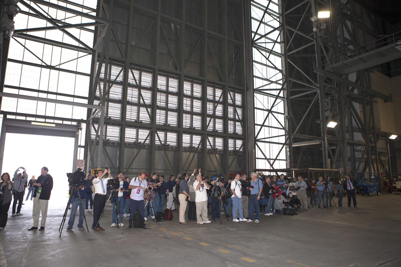 CAPE CANAVERAL, Fla. – At NASA's Kennedy Space Center in Florida, members of the news media tour the spaceport's Vehicle Assembly Building VAB. Like the Apollo Saturn V and space shuttles of the past, the Space Launch System rocket will be stacked and checked out in the VAB prion to being rolled to the launch pad.      Orion is the exploration spacecraft designed to carry astronauts to destinations not yet explored by humans, including an asteroid and Mars. It will have emergency abort capability, sustain the crew during space travel and provide safe re-entry from deep space return velocities. The first unpiloted flight test of Orion is scheduled to launch Dec. 4, 2014 atop a United Launch Alliance Delta IV Heavy rocket, and in 2018 on NASA’s Space Launch System rocket. For more information, visit www.nasa.gov/orion Photo credit: NASA/Kim Shiflett