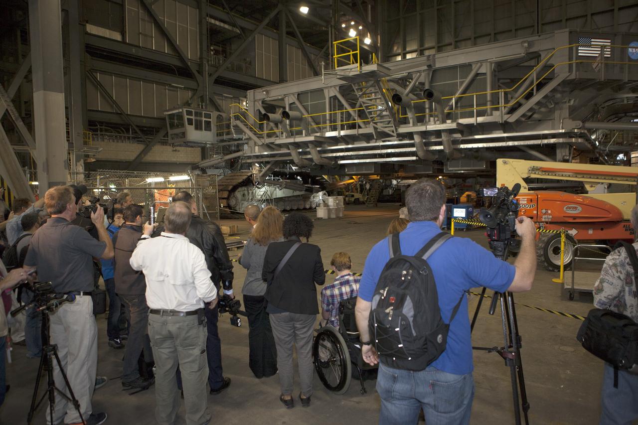CAPE CANAVERAL, Fla. – At NASA's Kennedy Space Center in Florida, members of the news media tour the spaceport's Vehicle Assembly Building. They were briefed on progress to upgrade and modify crawler-transporter CT 2 to support the Space Launch System.      Orion is the exploration spacecraft designed to carry astronauts to destinations not yet explored by humans, including an asteroid and Mars. It will have emergency abort capability, sustain the crew during space travel and provide safe re-entry from deep space return velocities. The first unpiloted flight test of Orion is scheduled to launch Dec. 4, 2014 atop a United Launch Alliance Delta IV Heavy rocket, and in 2018 on NASA’s Space Launch System rocket. For more information, visit www.nasa.gov/orion Photo credit: NASA/Kim Shiflett