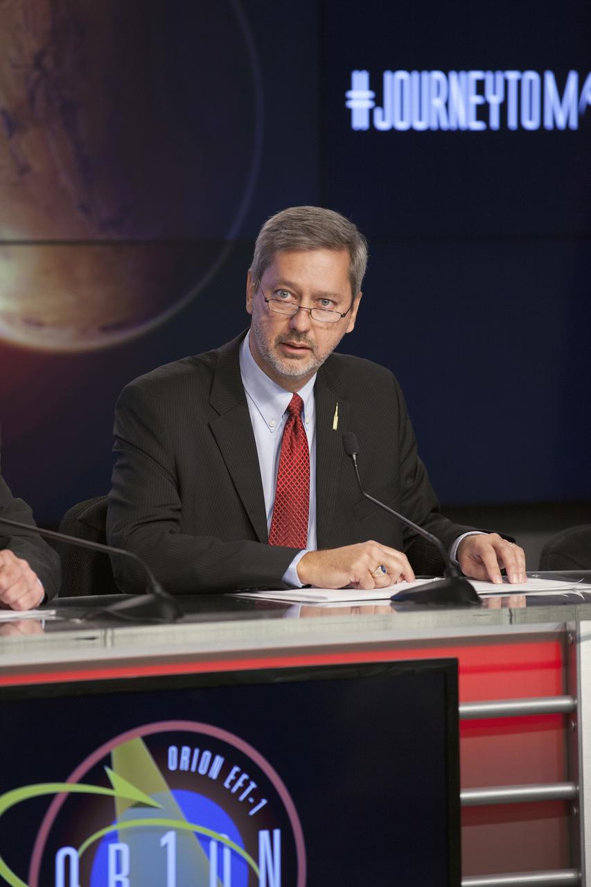 CAPE CANAVERAL, Fla. – At NASA's Kennedy Space Center in Florida, Chris Crumbly, manager of Space Launch System Spacecraft/Payload Integration and Evolution, was one of several agency leaders who spoke to member of the news media about how the first flight of the new Orion spacecraft is a first step in the agency's plans to send humans to Mars.      Orion is the exploration spacecraft designed to carry astronauts to destinations not yet explored by humans, including an asteroid and Mars. It will have emergency abort capability, sustain the crew during space travel and provide safe re-entry from deep space return velocities. The first unpiloted flight test of Orion is scheduled to launch Dec. 4, 2014 atop a United Launch Alliance Delta IV Heavy rocket, and in 2018 on NASA’s Space Launch System rocket. For more information, visit www.nasa.gov/orion Photo credit: NASA/Kim Shiflett