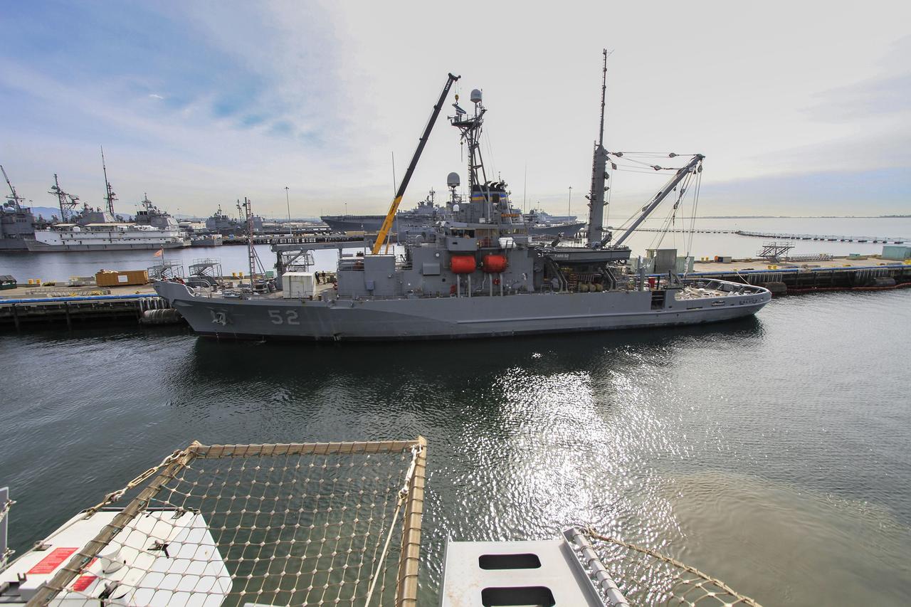 SAN DIEGO, Calif. – The USNS Salvor, a safeguard-class rescue and salvage ship, is docked at Naval Base San Diego in California. The ship will head out to sea along with the USS Anchorage ahead of Orion's first flight test. NASA and U.S. Navy personnel are making preparations ahead of Orion's flight test for recovery of the crew module, forward bay cover and parachutes on its return from space and splashdown in the Pacific Ocean. If needed, the Salvor would be used for an alternate recovery method. Ground Systems Development and Operations Program is leading the recovery efforts. The first unpiloted flight test of Orion is scheduled to launch this week atop a United Launch Alliance Delta IV Heavy rocket. During its two-orbit, 4.5-hour flight, Orion will venture 3,600 miles in altitude and travel nearly 60,000 miles before returning to Earth for a splashdown in the Pacific Ocean. For more information, visit http://www.nasa.gov/orion. Photo credit: NASA/Cory Huston