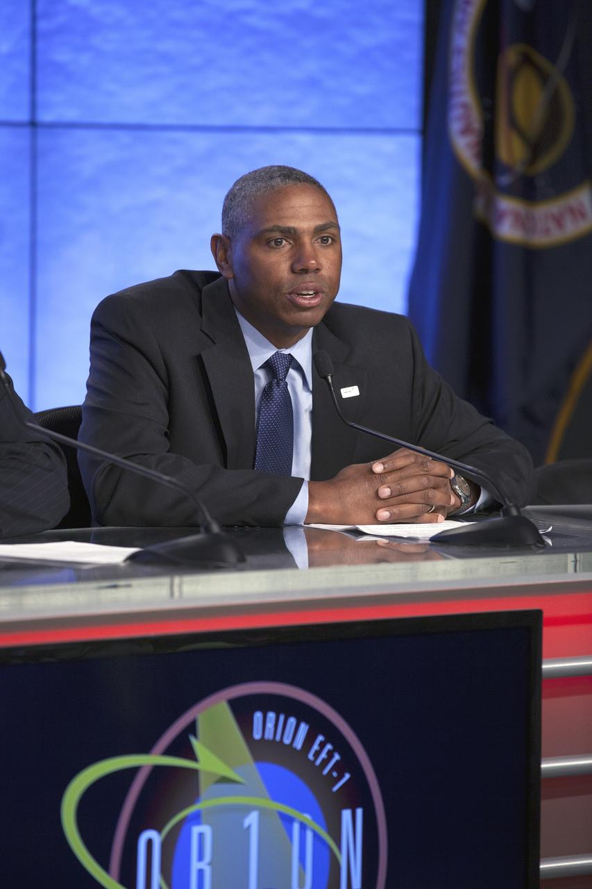 CAPE CANAVERAL, Fla. – In the Kennedy Space Center’s Press Site auditorium, Ron Fortson, United Launch Alliance director of mission management, was among agency and industry leaders who spoke to members of the news media as the Orion spacecraft and its Delta IV Heavy rocket were being prepared for launch.    Orion is the exploration spacecraft designed to carry astronauts to destinations not yet explored by humans, including an asteroid and Mars. It will have emergency abort capability, sustain the crew during space travel and provide safe re-entry from deep space return velocities. The first unpiloted flight test of Orion is scheduled to launch Dec. 4, 2014 atop a United Launch Alliance Delta IV Heavy rocket, and in 2018 on NASA’s Space Launch System rocket. For more information, visit www.nasa.gov/orion Photo credit: NASA/Kim Shiflett