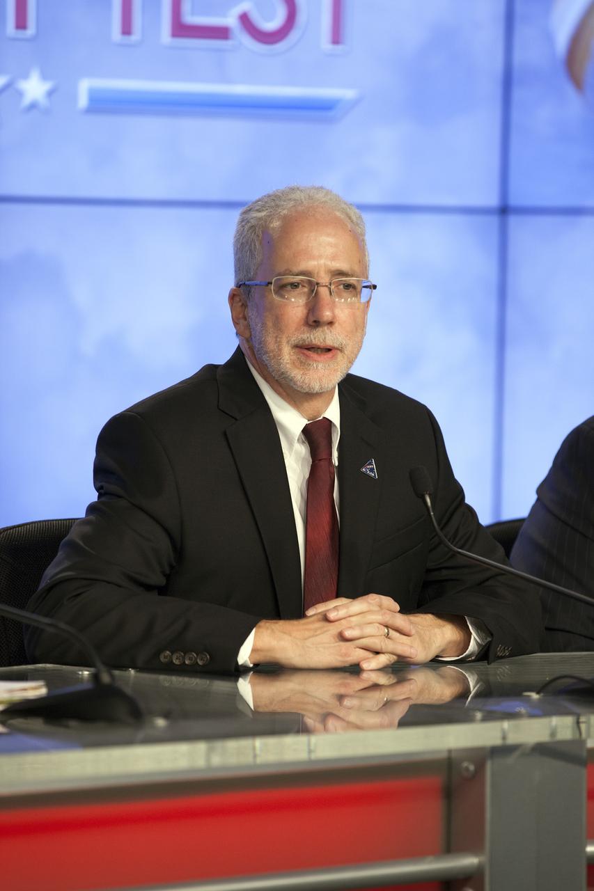 CAPE CANAVERAL, Fla. – In the Kennedy Space Center’s Press Site auditorium, Mark Geyer, Orion program manager, was among agency and industry leaders who spoke to members of the news media as the Orion spacecraft and its Delta IV Heavy rocket were being prepared for launch.    Orion is the exploration spacecraft designed to carry astronauts to destinations not yet explored by humans, including an asteroid and Mars. It will have emergency abort capability, sustain the crew during space travel and provide safe re-entry from deep space return velocities. The first unpiloted flight test of Orion is scheduled to launch Dec. 4, 2014 atop a United Launch Alliance Delta IV Heavy rocket, and in 2018 on NASA’s Space Launch System rocket. For more information, visit www.nasa.gov/orion Photo credit: NASA/Kim Shiflett